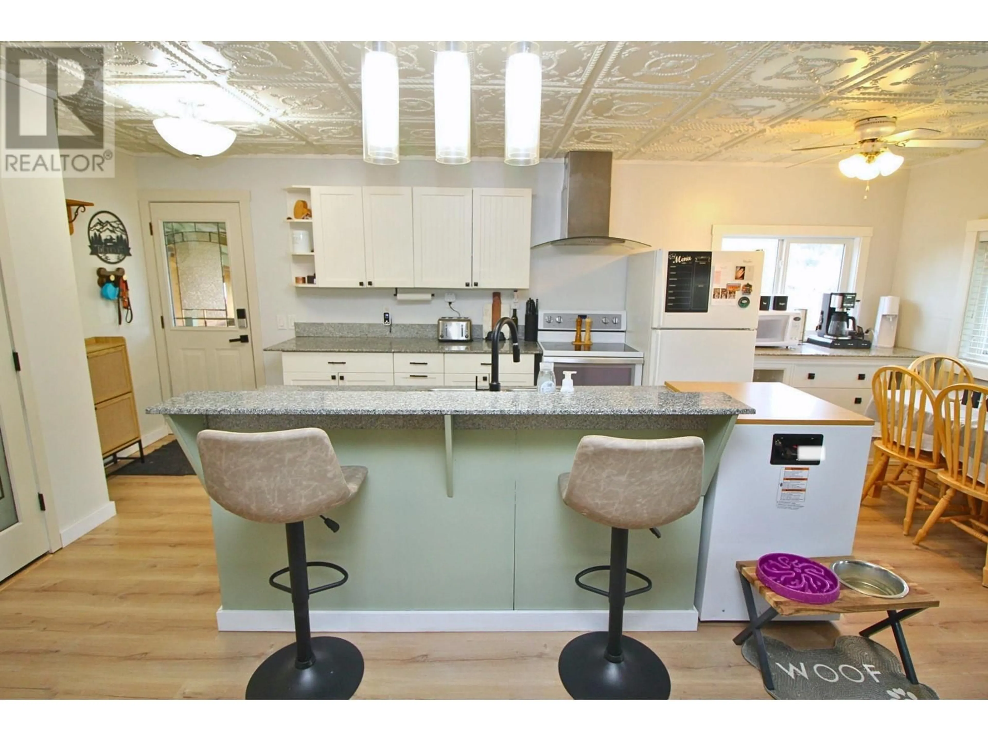 Open concept kitchen, wood/laminate floor for 21780 RAILWAY AVENUE, Topley British Columbia V0J2Y0