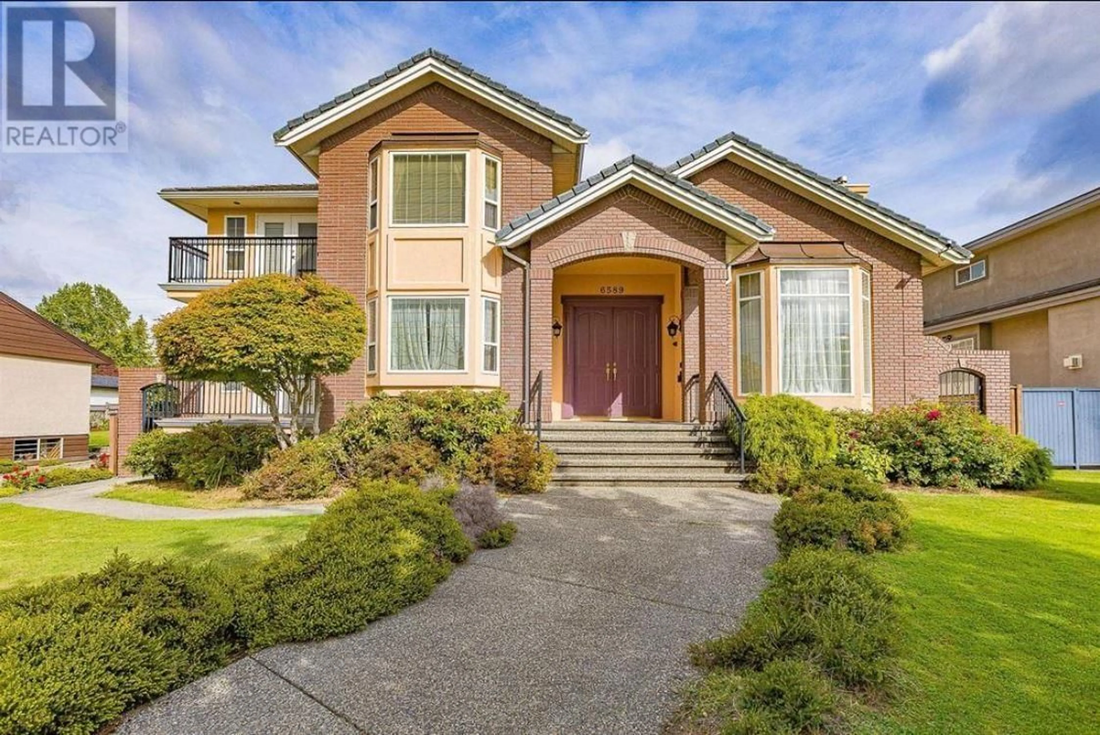 Home with brick exterior material, street for 6589 KITCHENER STREET, Burnaby British Columbia V5B2J7