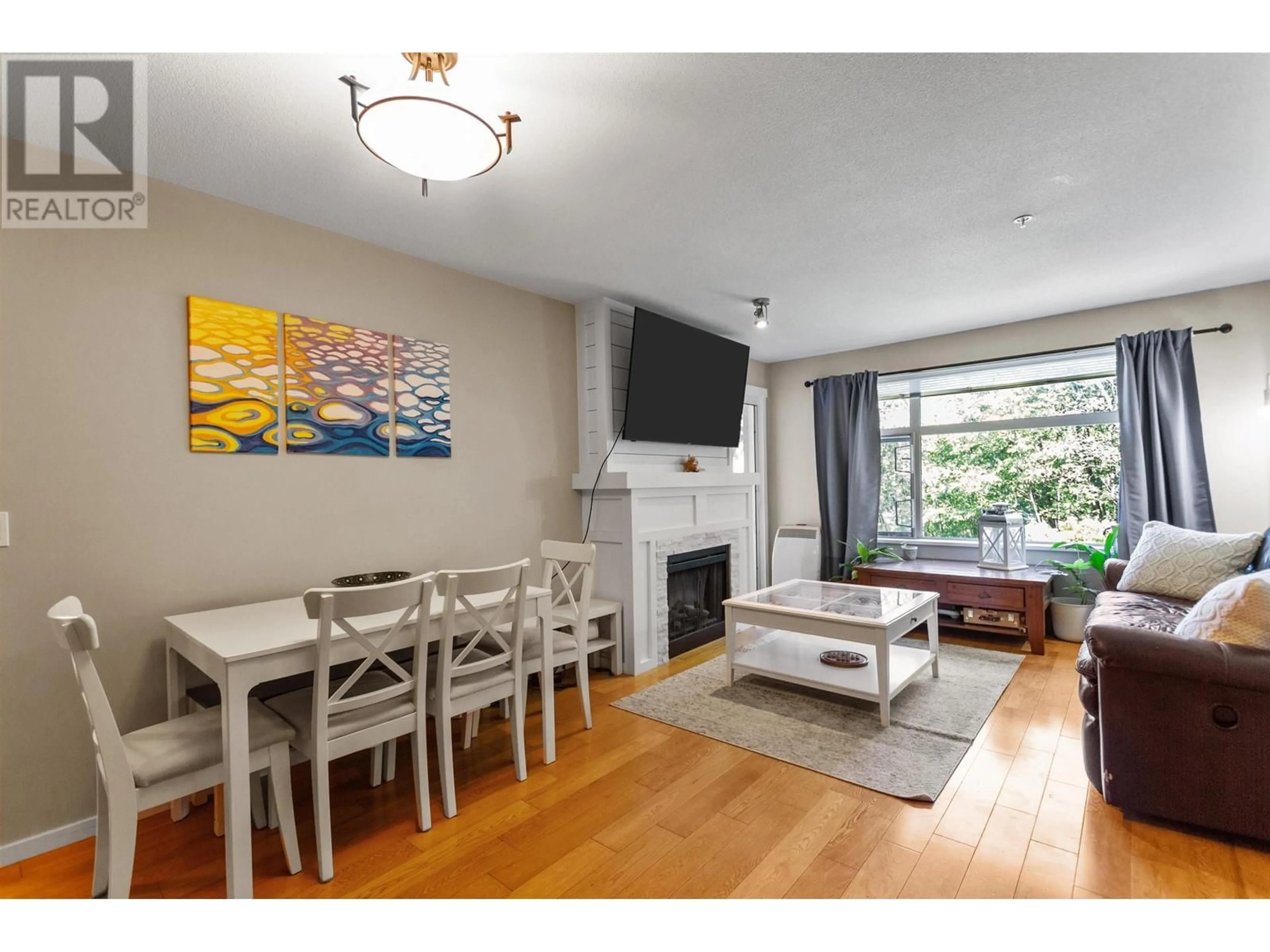 Living room with furniture, wood/laminate floor for 315 - 400 KLAHANIE DRIVE, Port Moody British Columbia V3H5K9