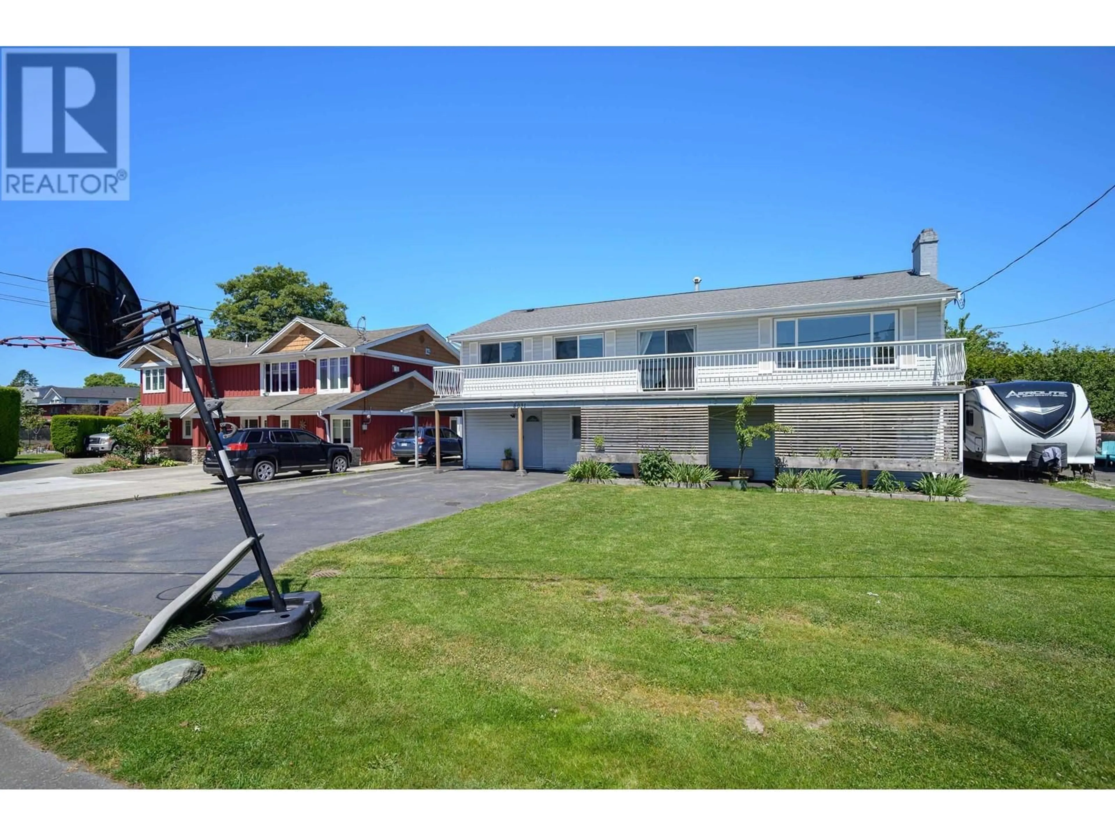 A pic from outside/outdoor area/front of a property/back of a property/a pic from drone, street for 5031 44B AVENUE, Ladner British Columbia V4K1J2