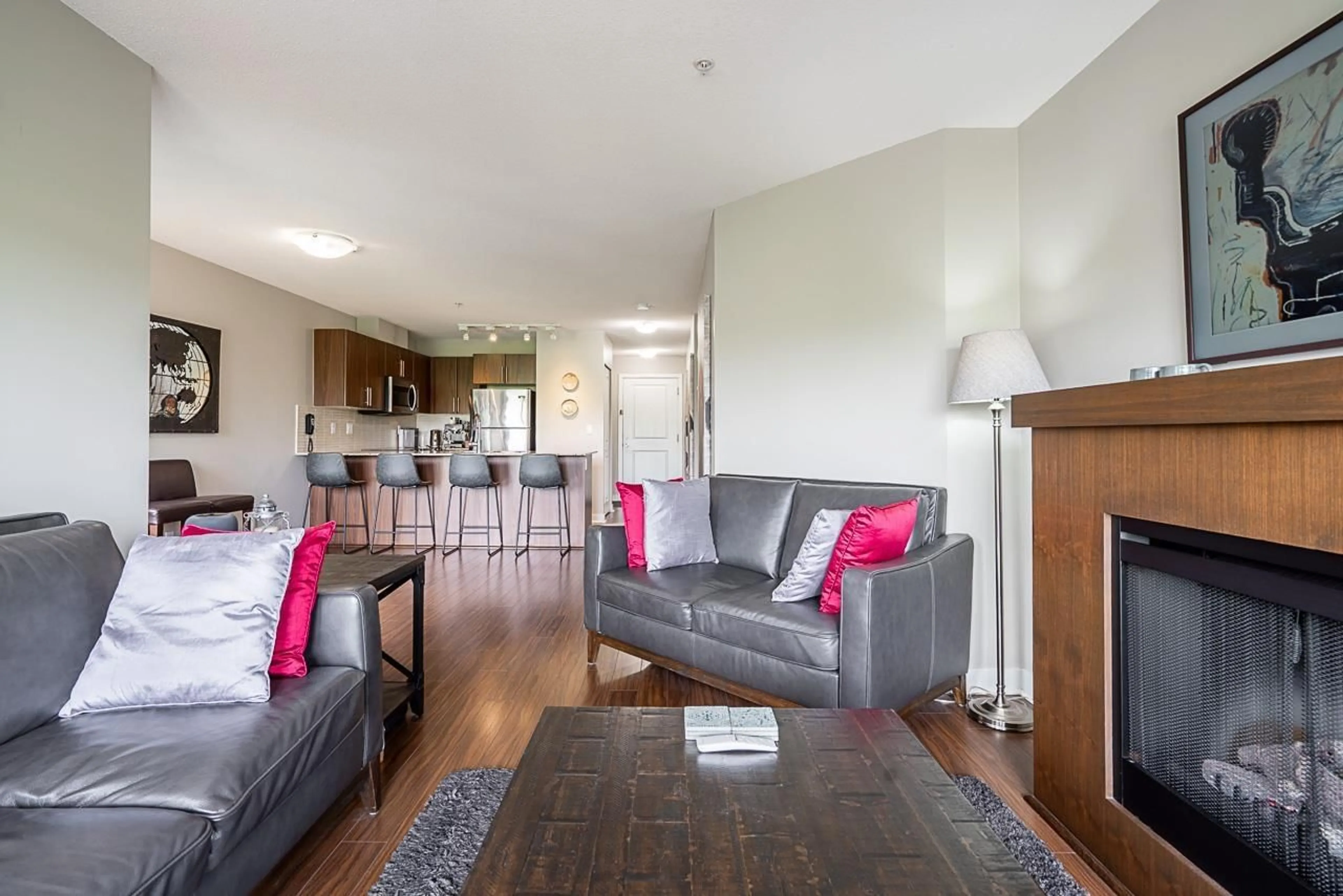 Living room with furniture, wood/laminate floor for D307 - 8929 202, Langley British Columbia V1M0B4