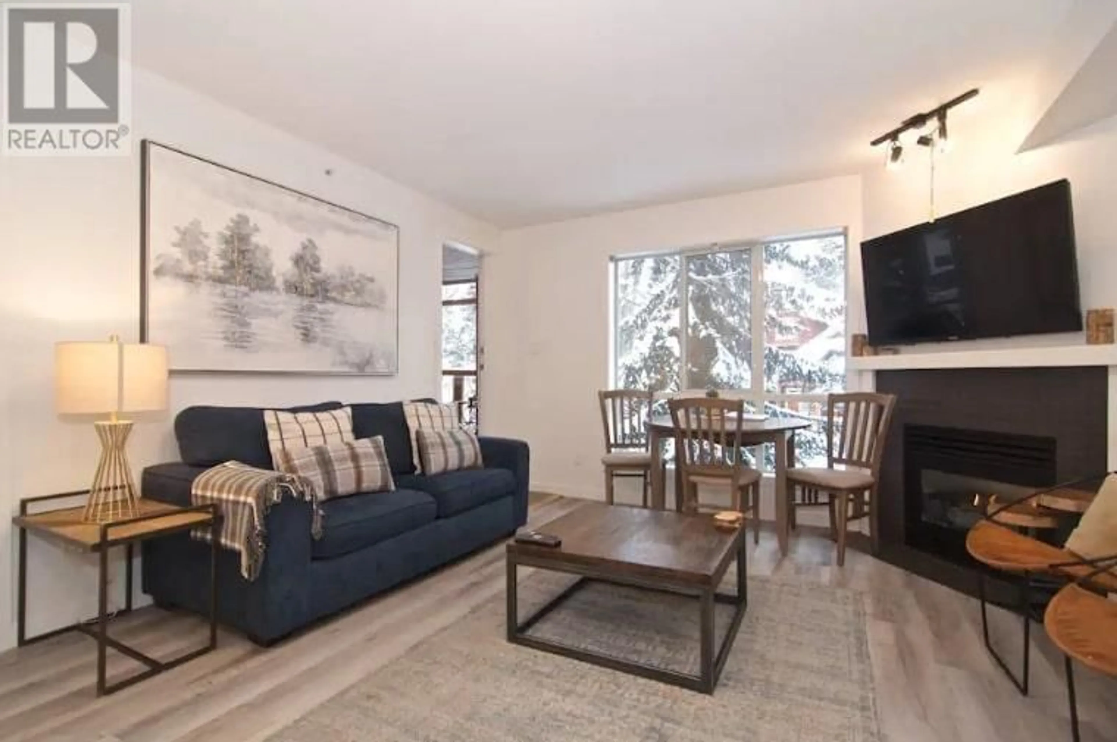 Living room with furniture, wood/laminate floor for 34/34A - 4388 NORTHLANDS BOULEVARD, Whistler British Columbia V8E1C6