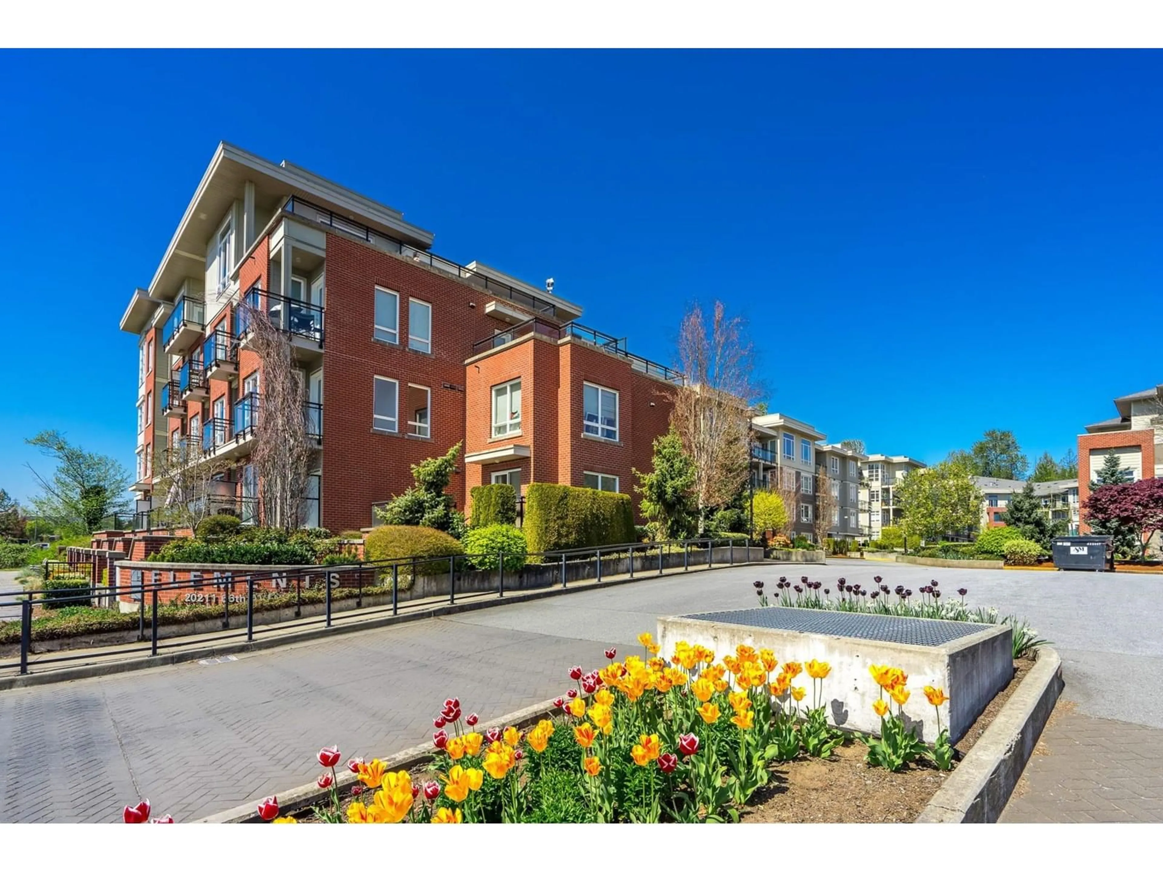 A pic from outside/outdoor area/front of a property/back of a property/a pic from drone, street for D315 - 20211 66, Langley British Columbia V2Y0L4