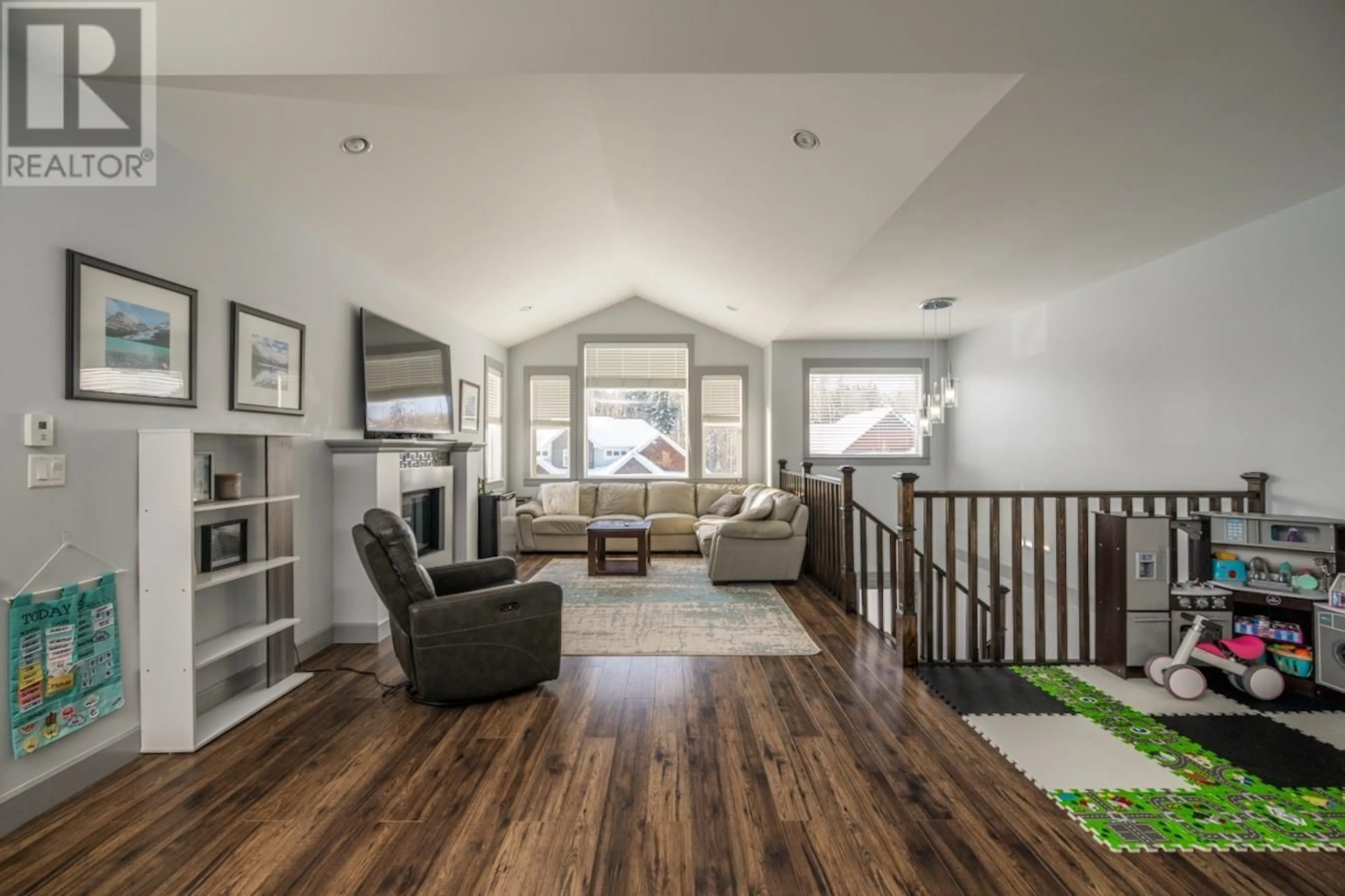 Living room with furniture, wood/laminate floor for 2838 MAURICE DRIVE, Prince George British Columbia V2N0C8