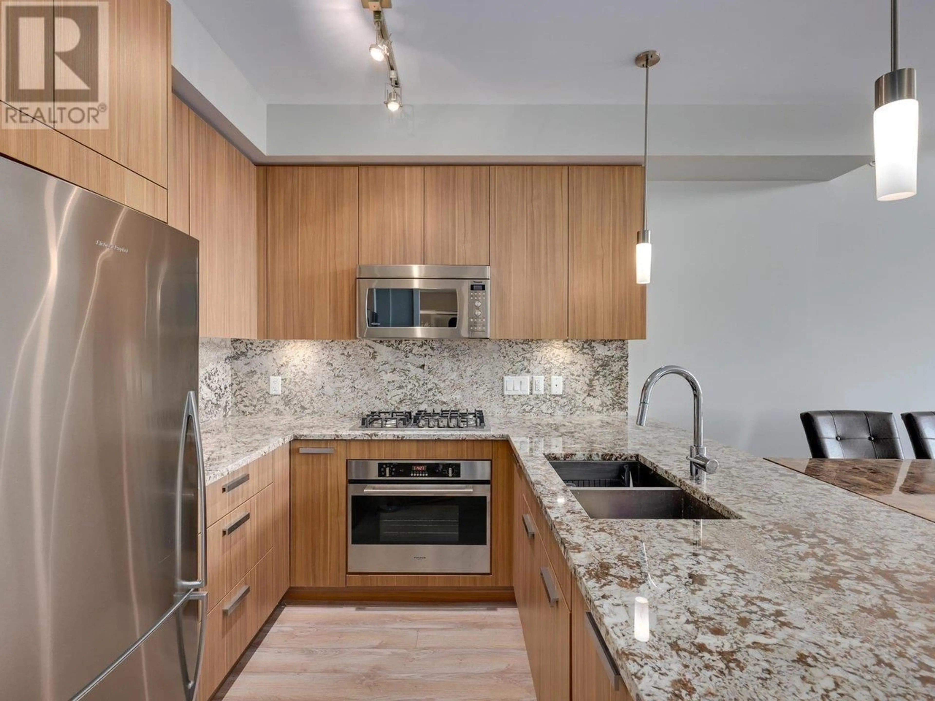 Contemporary kitchen, ceramic/tile floor for 409 - 4307 HASTINGS STREET, Burnaby British Columbia V5C2J7