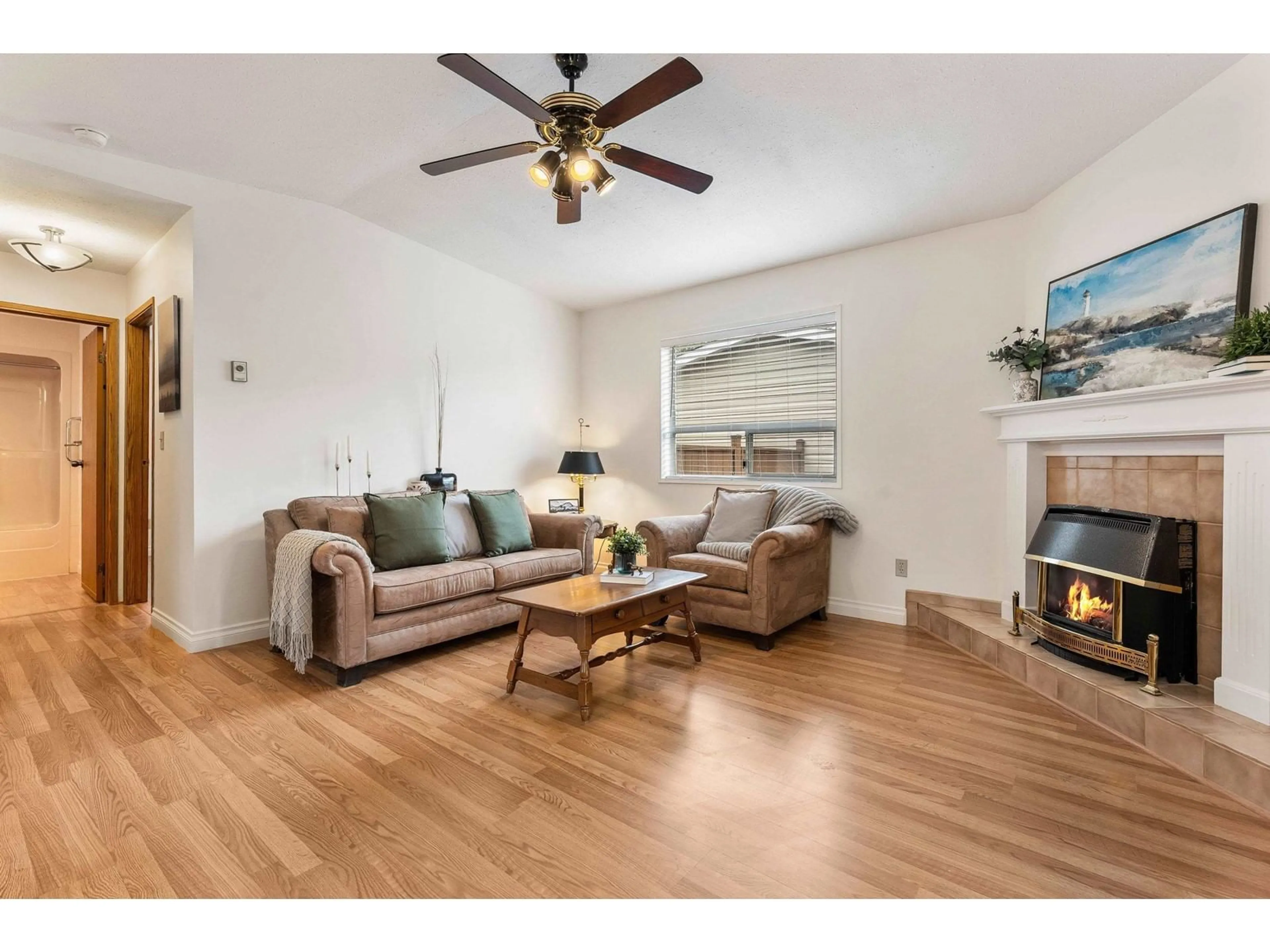Living room with furniture, wood/laminate floor for 179 - 9055 ASHWELL ROAD, Chilliwack British Columbia V2P7S6