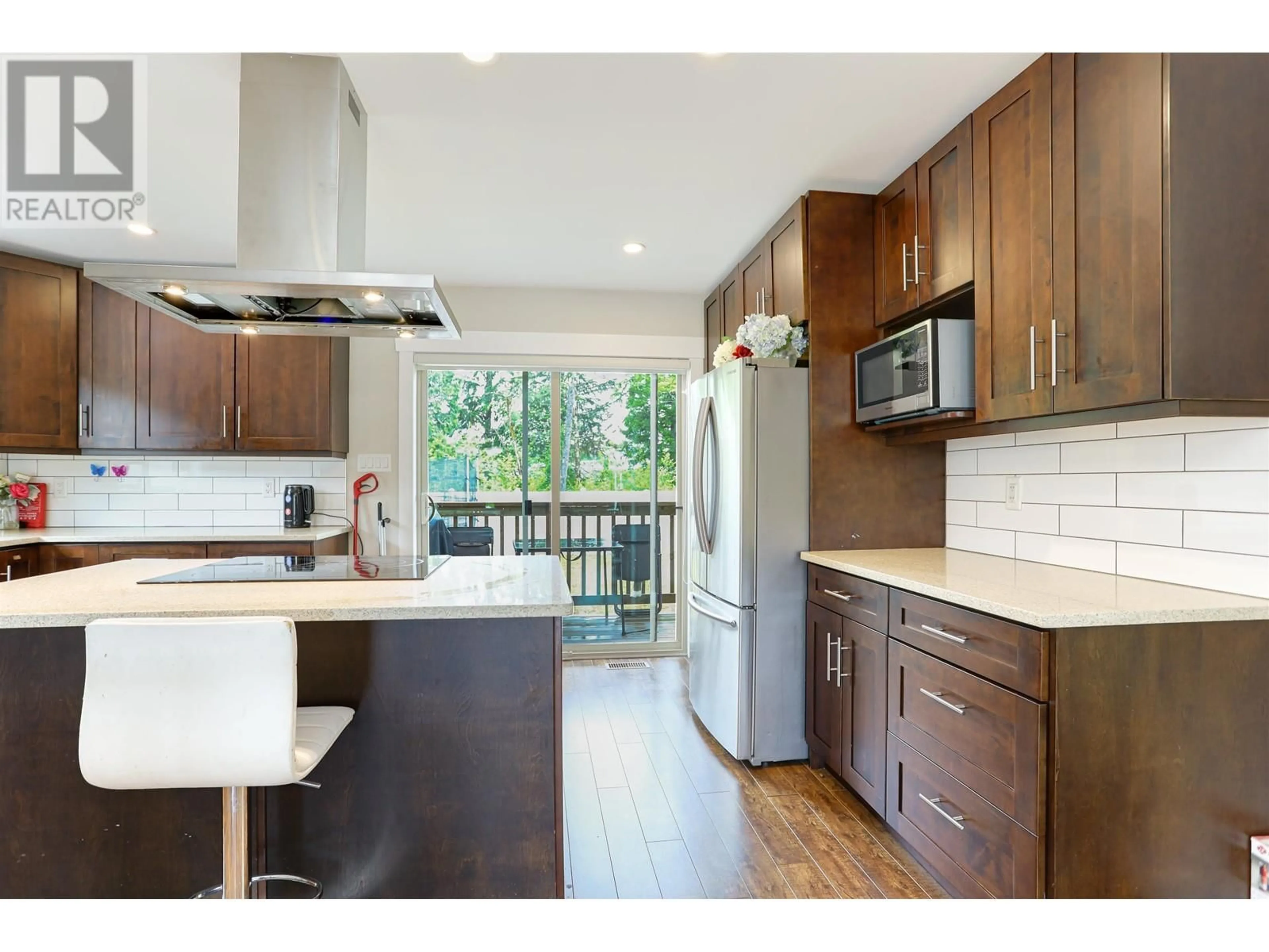Open concept kitchen, wood/laminate floor for 88 BLACKBERRY STREET, Kitimat British Columbia V8C0A6