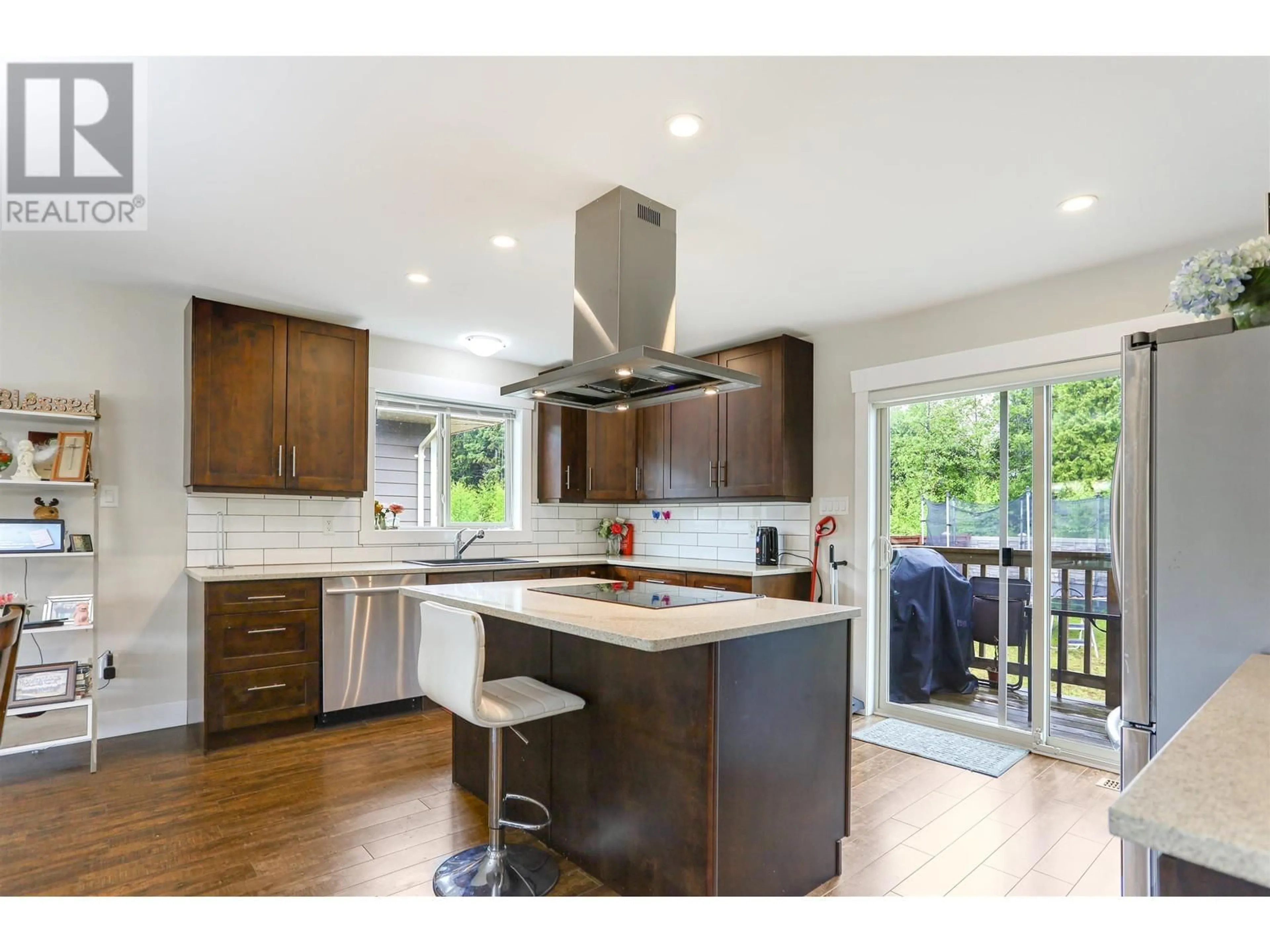 Open concept kitchen, wood/laminate floor for 88 BLACKBERRY STREET, Kitimat British Columbia V8C0A6