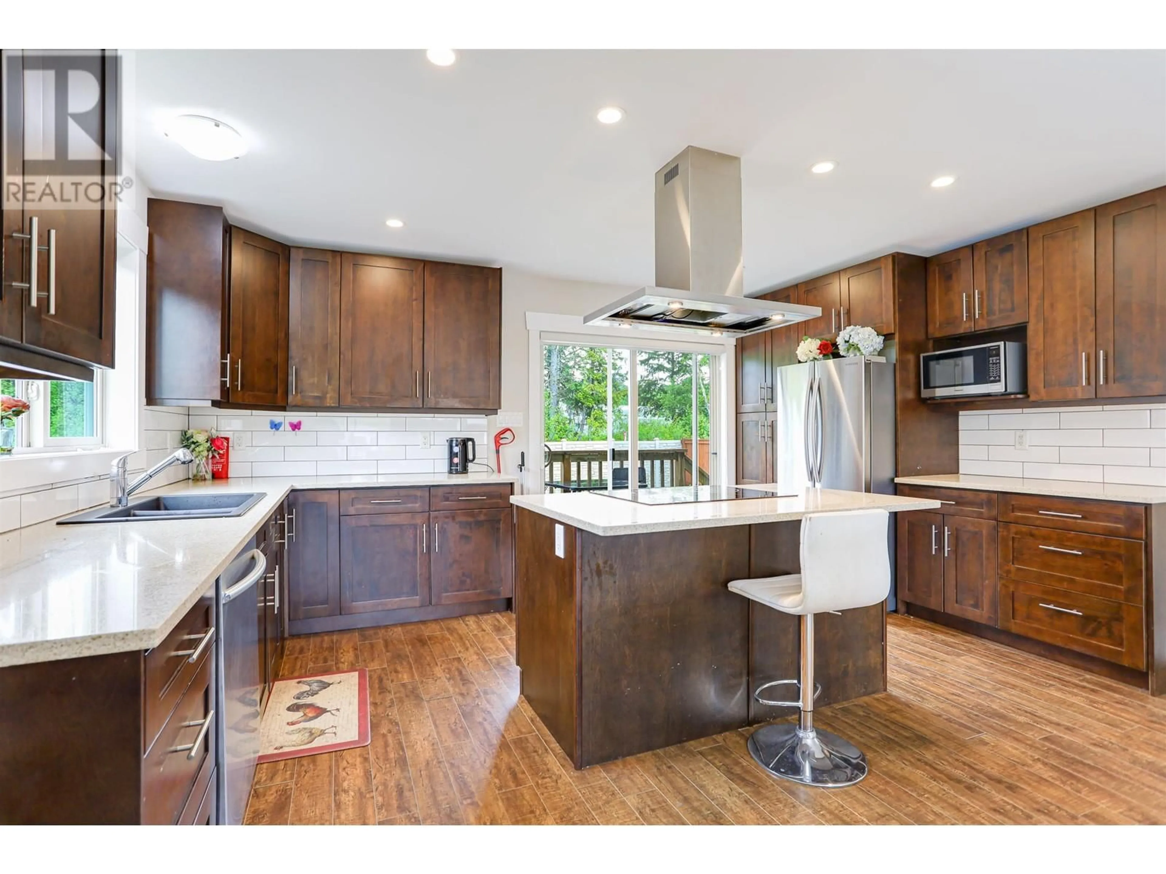 Open concept kitchen, wood/laminate floor for 88 BLACKBERRY STREET, Kitimat British Columbia V8C0A6
