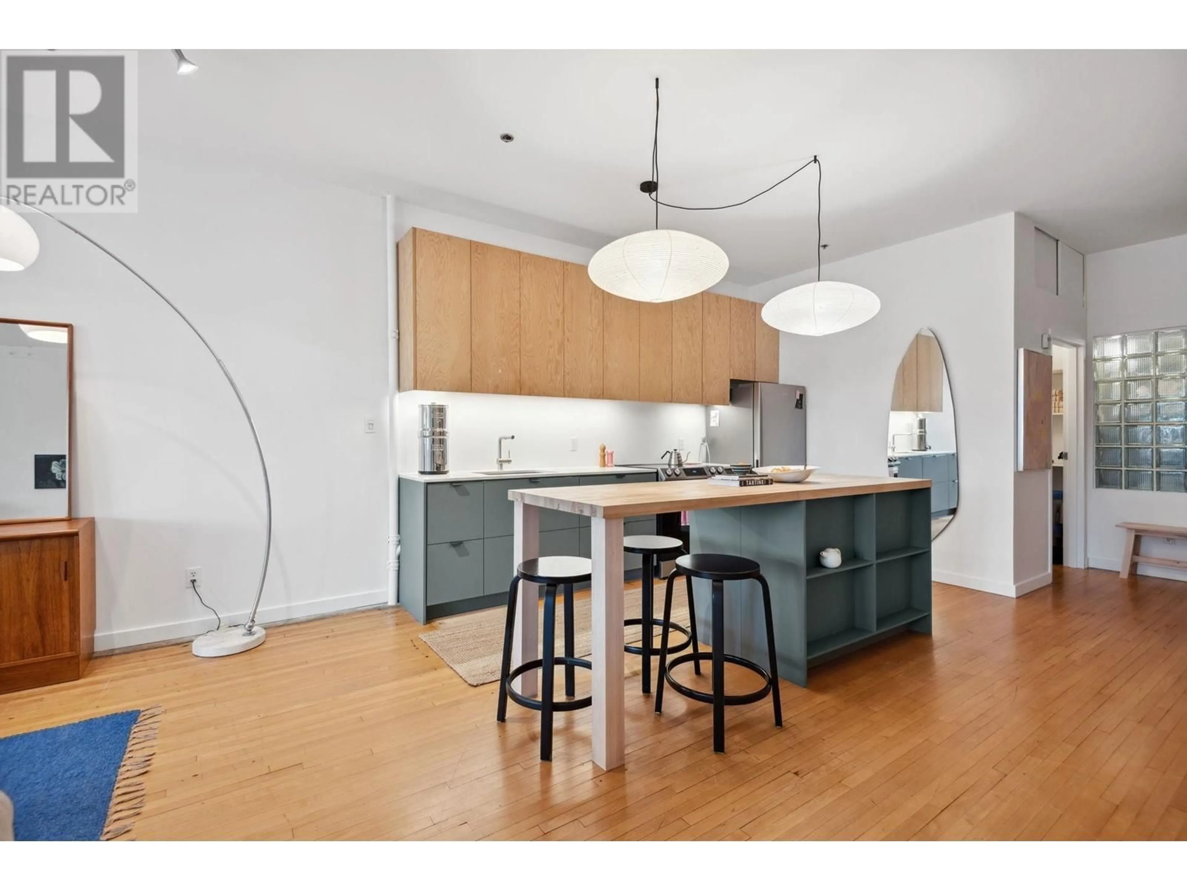 Open concept kitchen, wood/laminate floor for 209 - 2556 HASTINGS STREET, Vancouver British Columbia V5K1Z3
