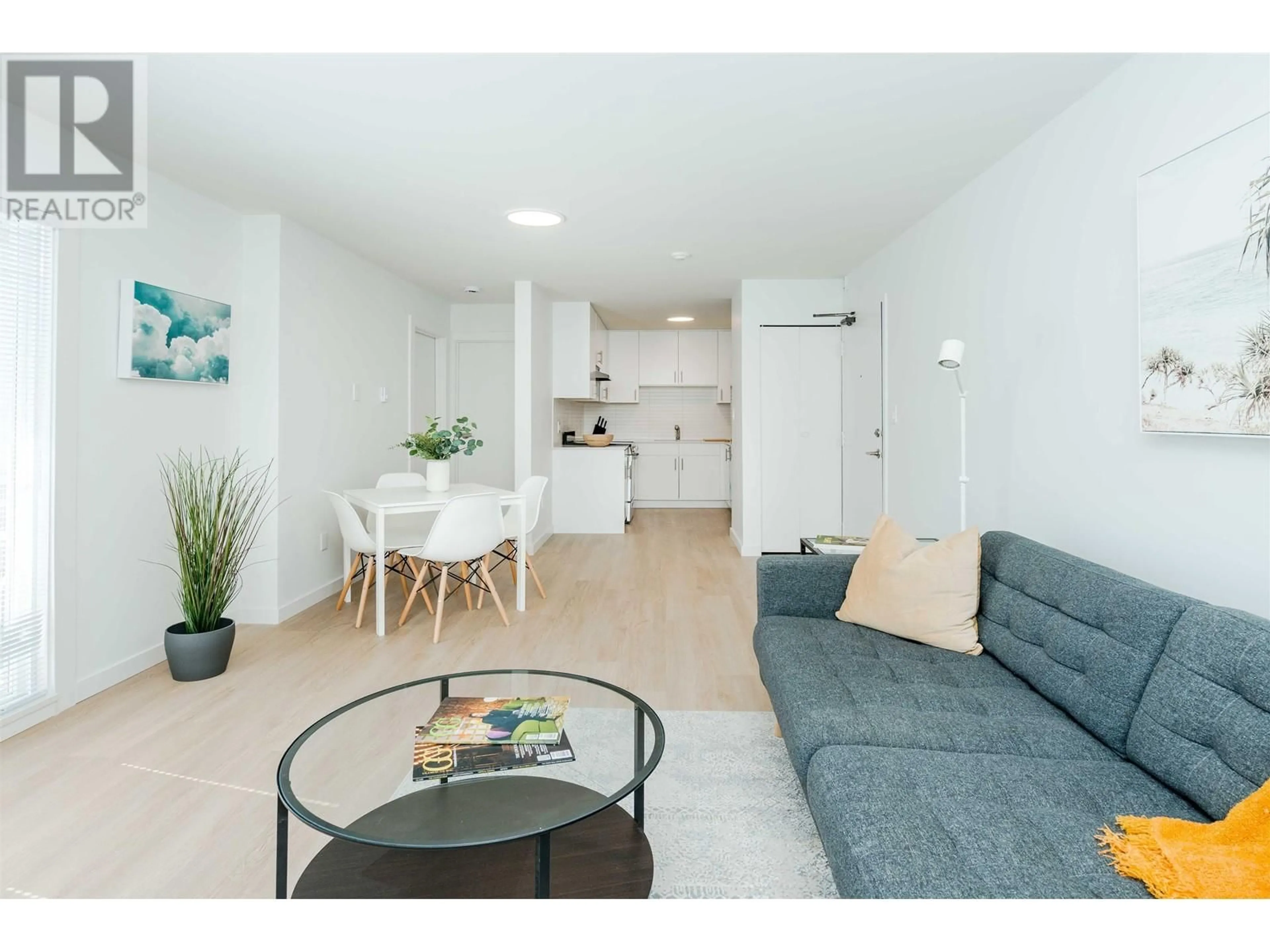 Living room with furniture, wood/laminate floor for 302 - 8690 MONTCALM STREET, Vancouver British Columbia V6P4P8