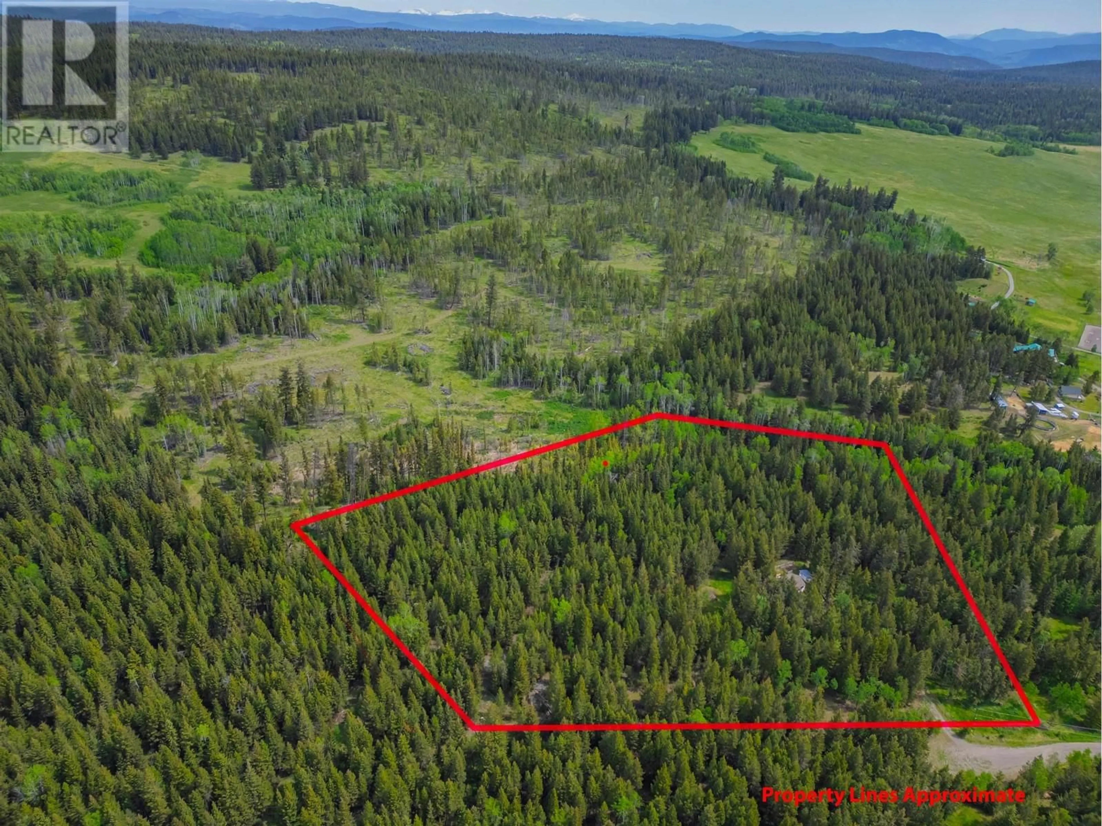 A pic from outside/outdoor area/front of a property/back of a property/a pic from drone, forest/trees view for 4919 LATHAM ROAD, 100 Mile House British Columbia V0K2E1
