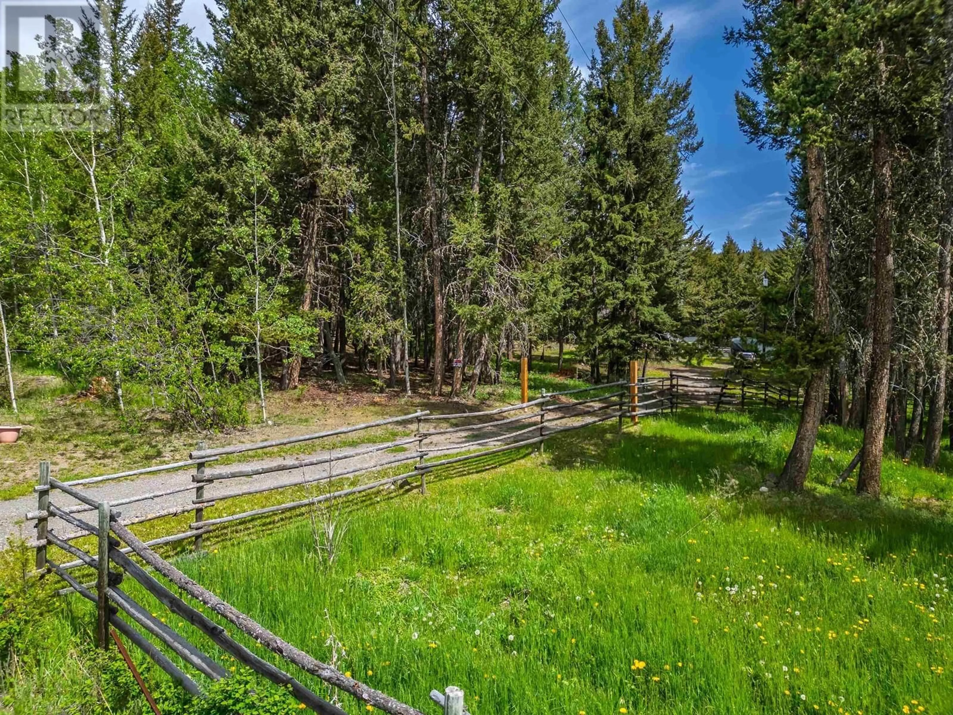 A pic from outside/outdoor area/front of a property/back of a property/a pic from drone, forest/trees view for 4919 LATHAM ROAD, 100 Mile House British Columbia V0K2E1