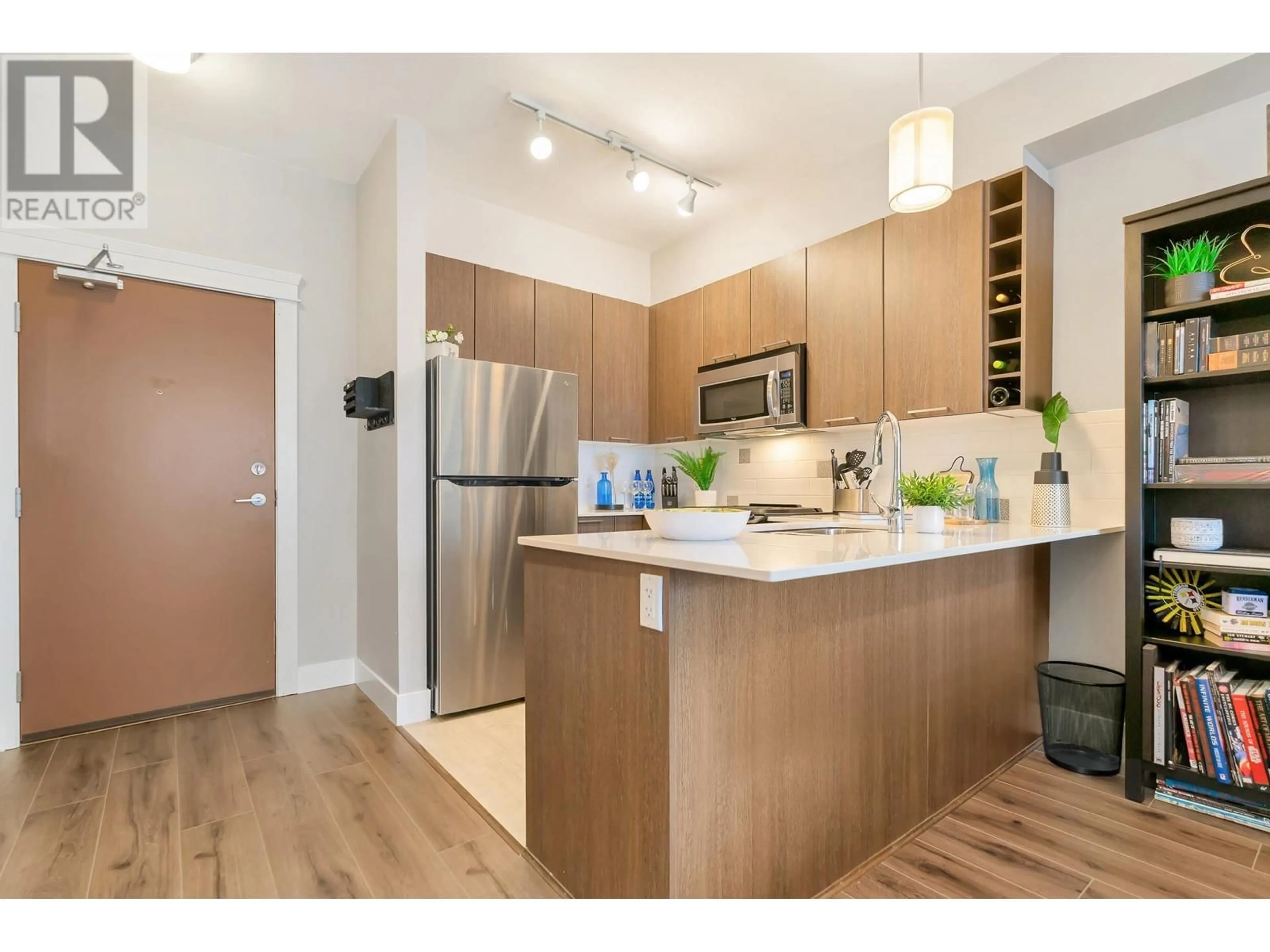 Open concept kitchen, wood/laminate floor for 203 - 1188 JOHNSON STREET, Coquitlam British Columbia V3B0H7