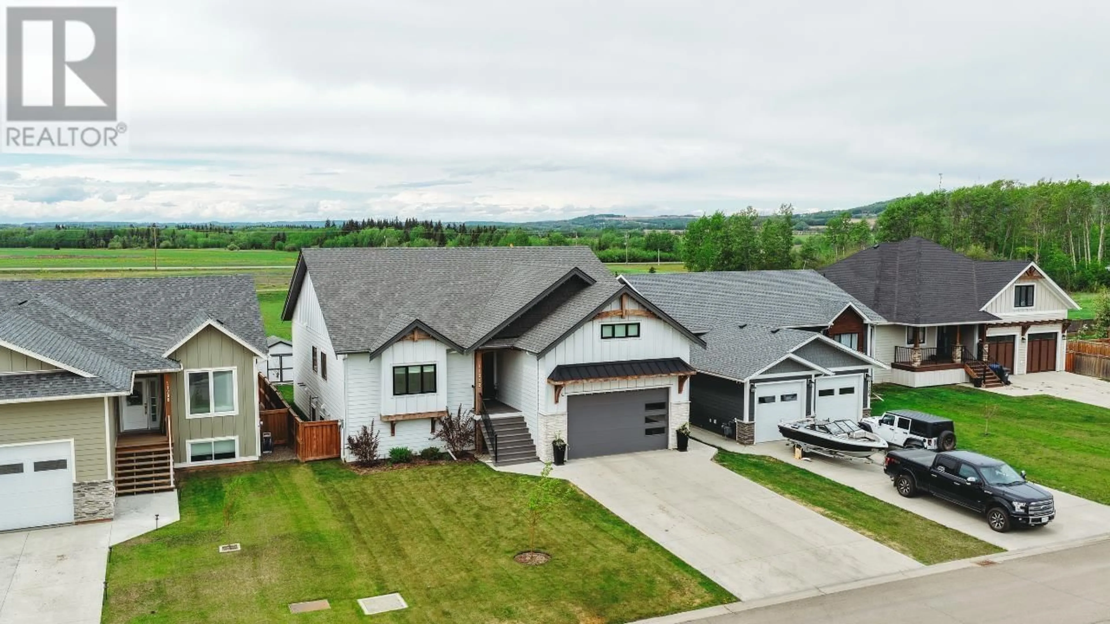 A pic from outside/outdoor area/front of a property/back of a property/a pic from drone, mountain view for 11212 113 STREET, Fort St. John British Columbia V1J0R5