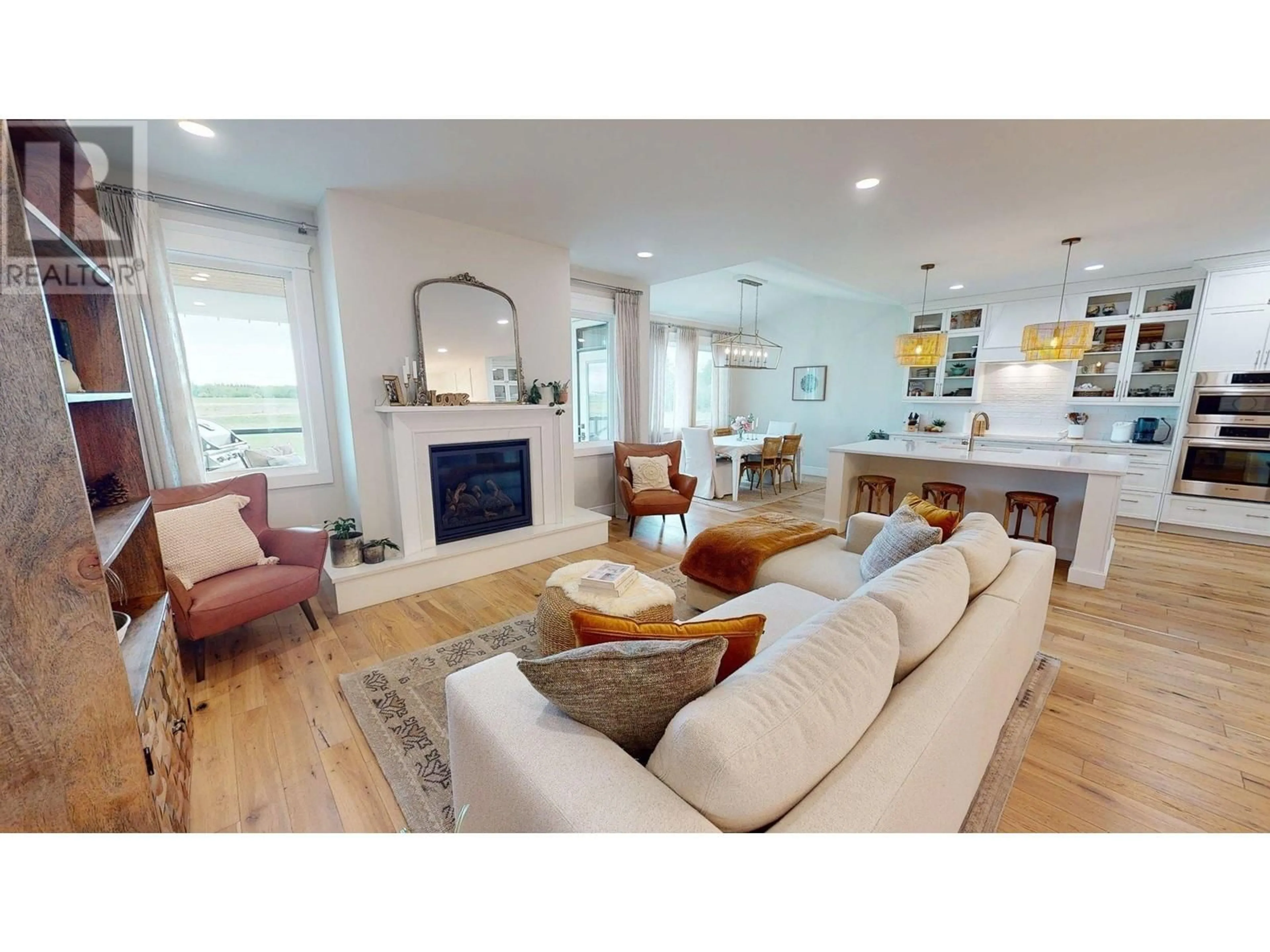 Living room with furniture, wood/laminate floor for 11212 113 STREET, Fort St. John British Columbia V1J0R5