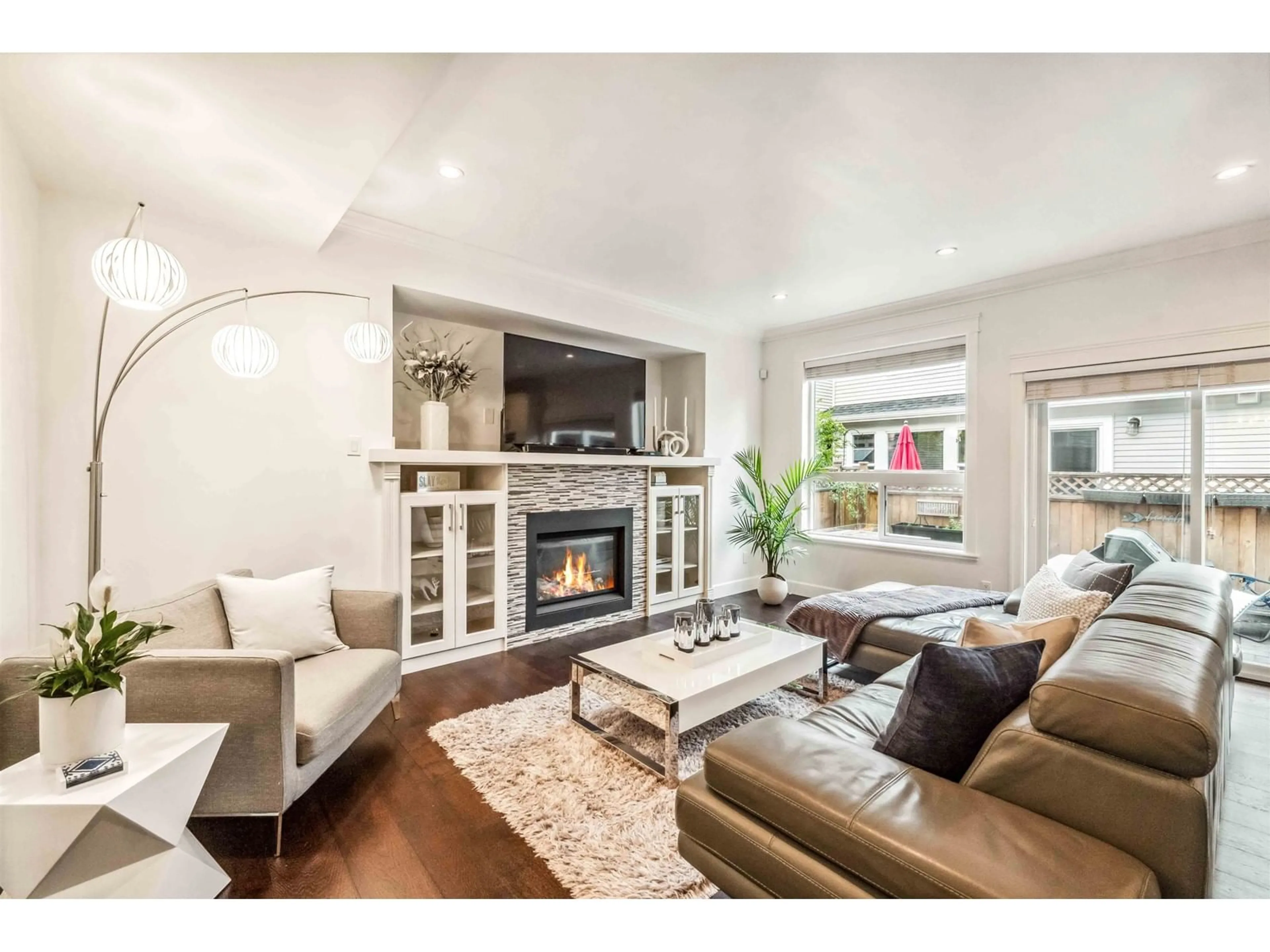 Living room with furniture, wood/laminate floor for 21 - 21267 83A, Langley British Columbia V2Y0E6