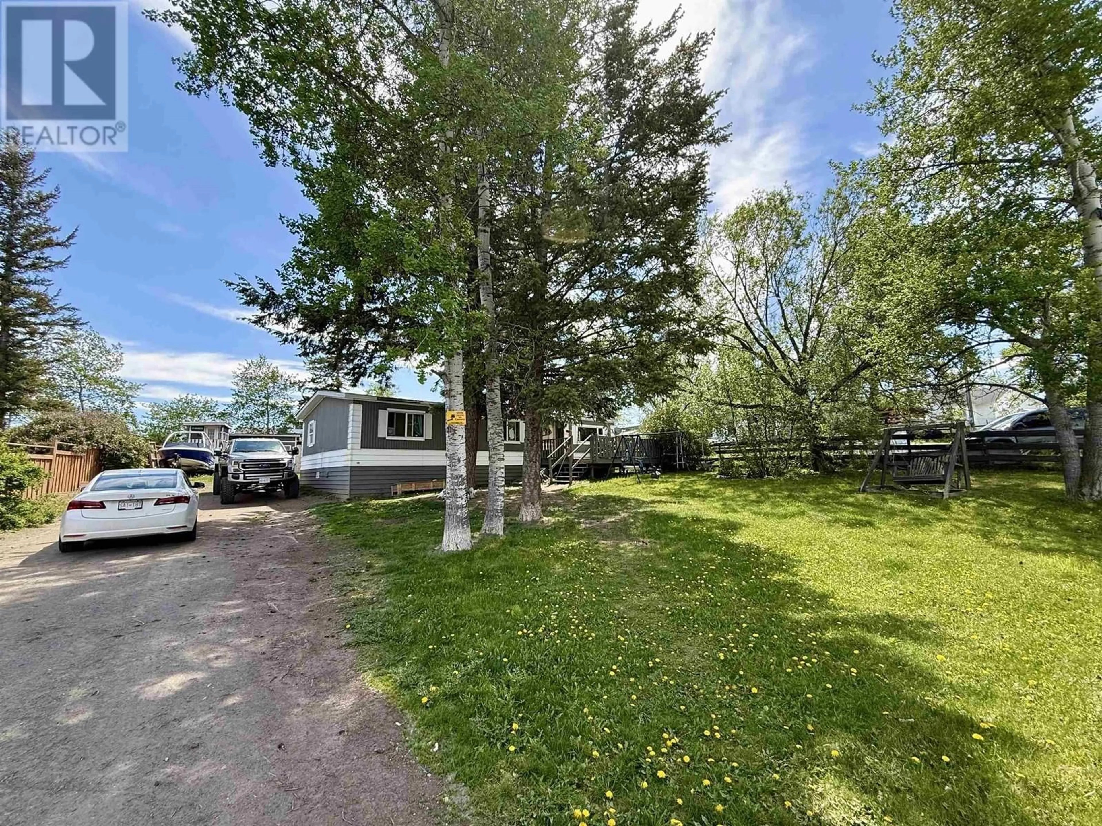 A pic from outside/outdoor area/front of a property/back of a property/a pic from drone, unknown for 5586 103 MILE LAKE ROAD, 103 Mile House British Columbia V0K2E1