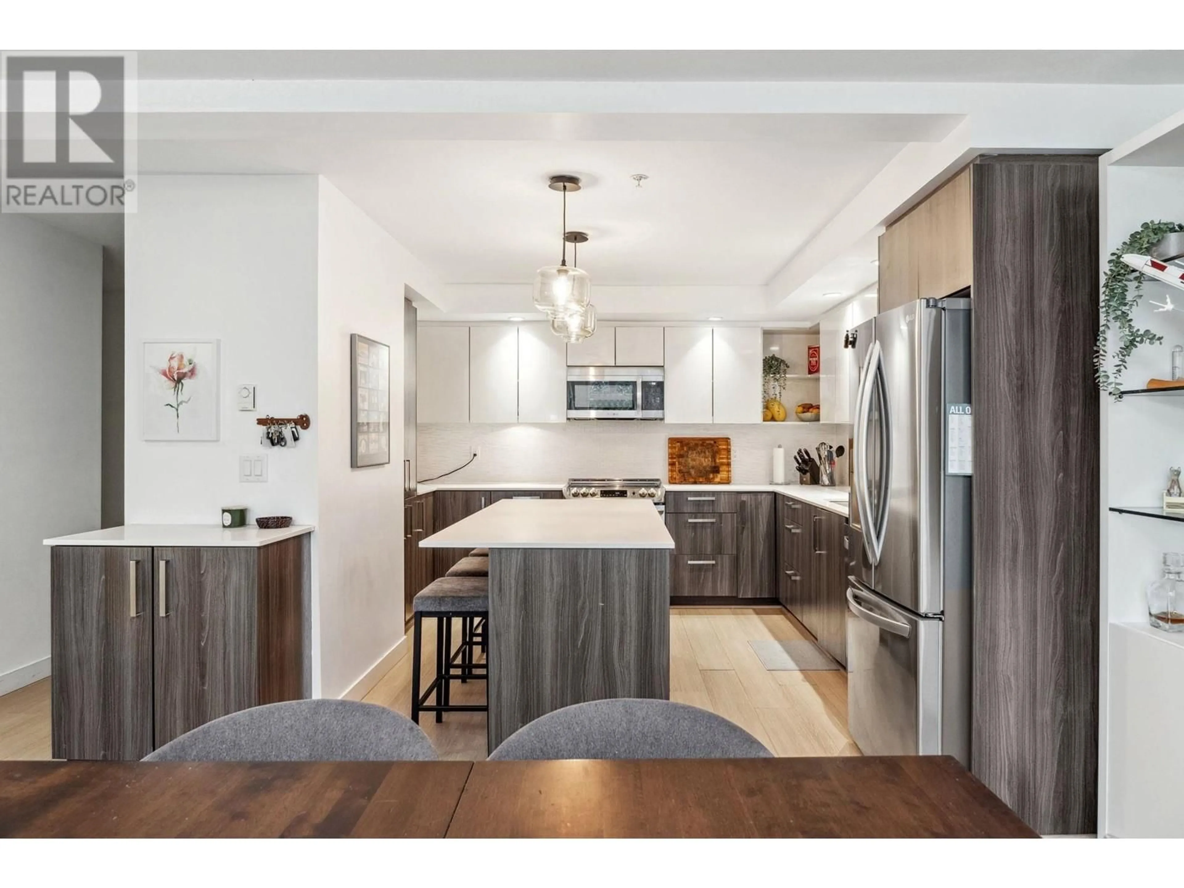 Open concept kitchen, wood/laminate floor for 501 - 160 SHORELINE CIRCLE, Port Moody British Columbia V3H0B2