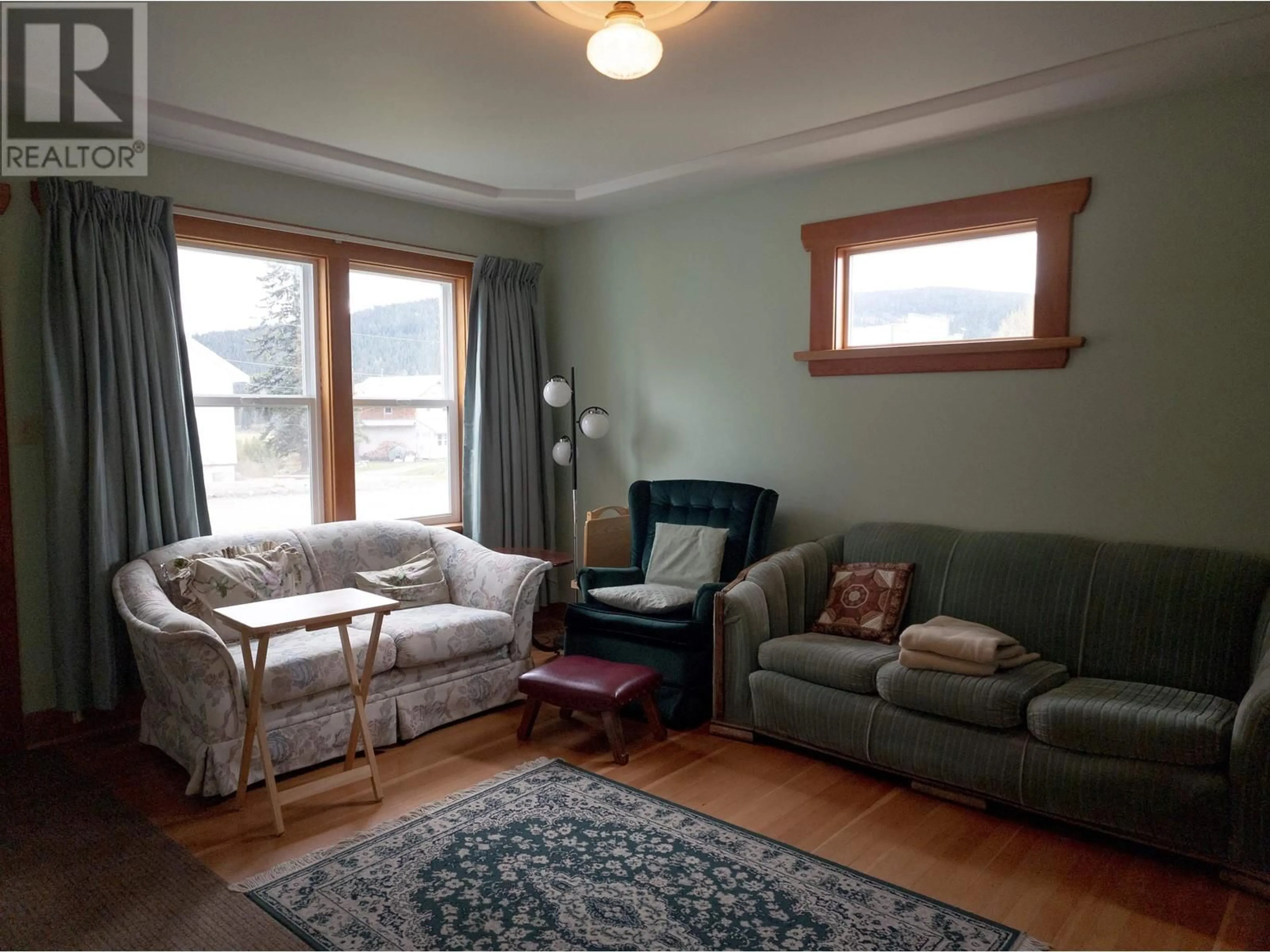 Living room with furniture, wood/laminate floor for 4317 SANDERS AVENUE, Wells / Barkerville British Columbia V0K2R0