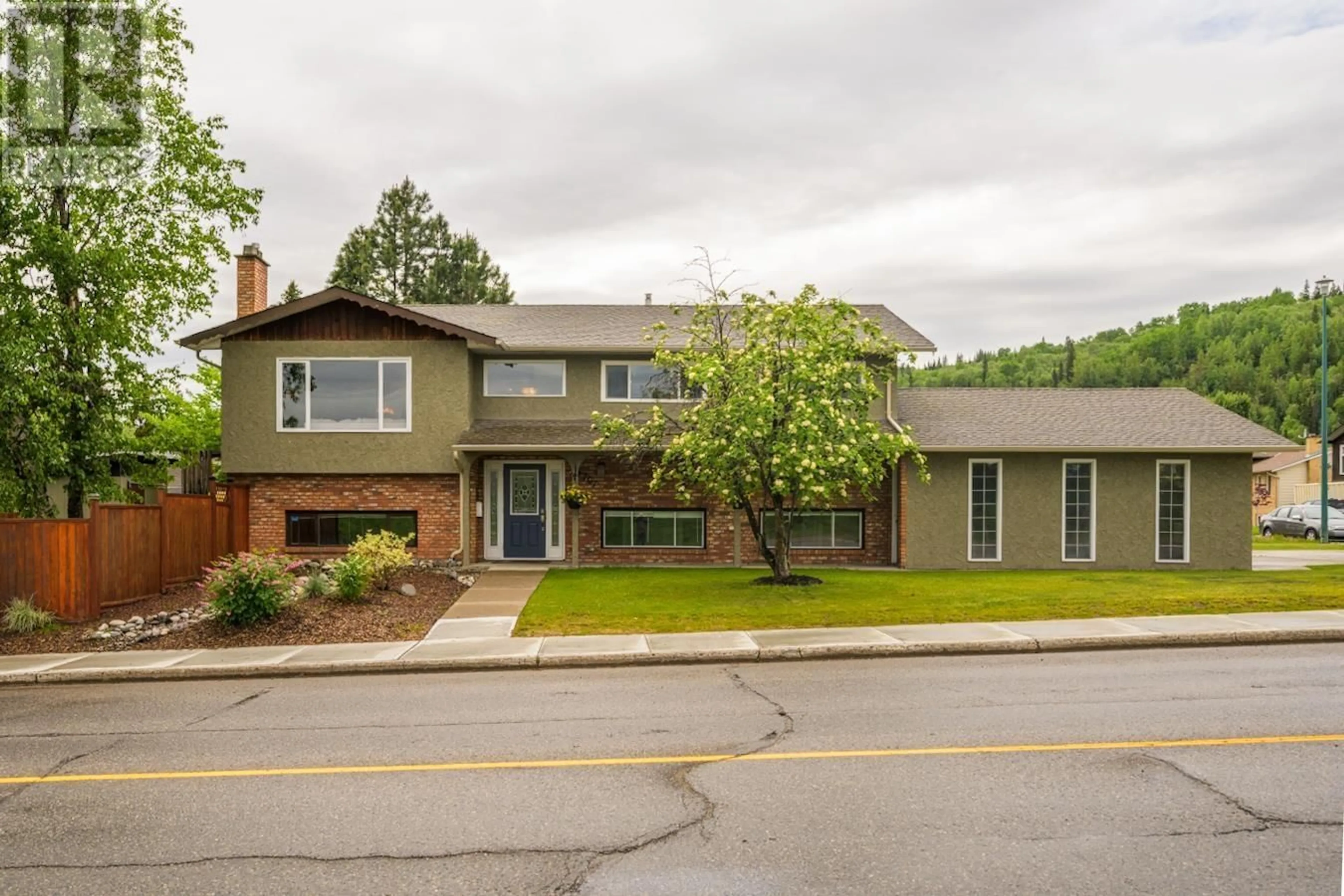 Home with brick exterior material, street for 4707 1ST AVENUE, Prince George British Columbia V2M6V1