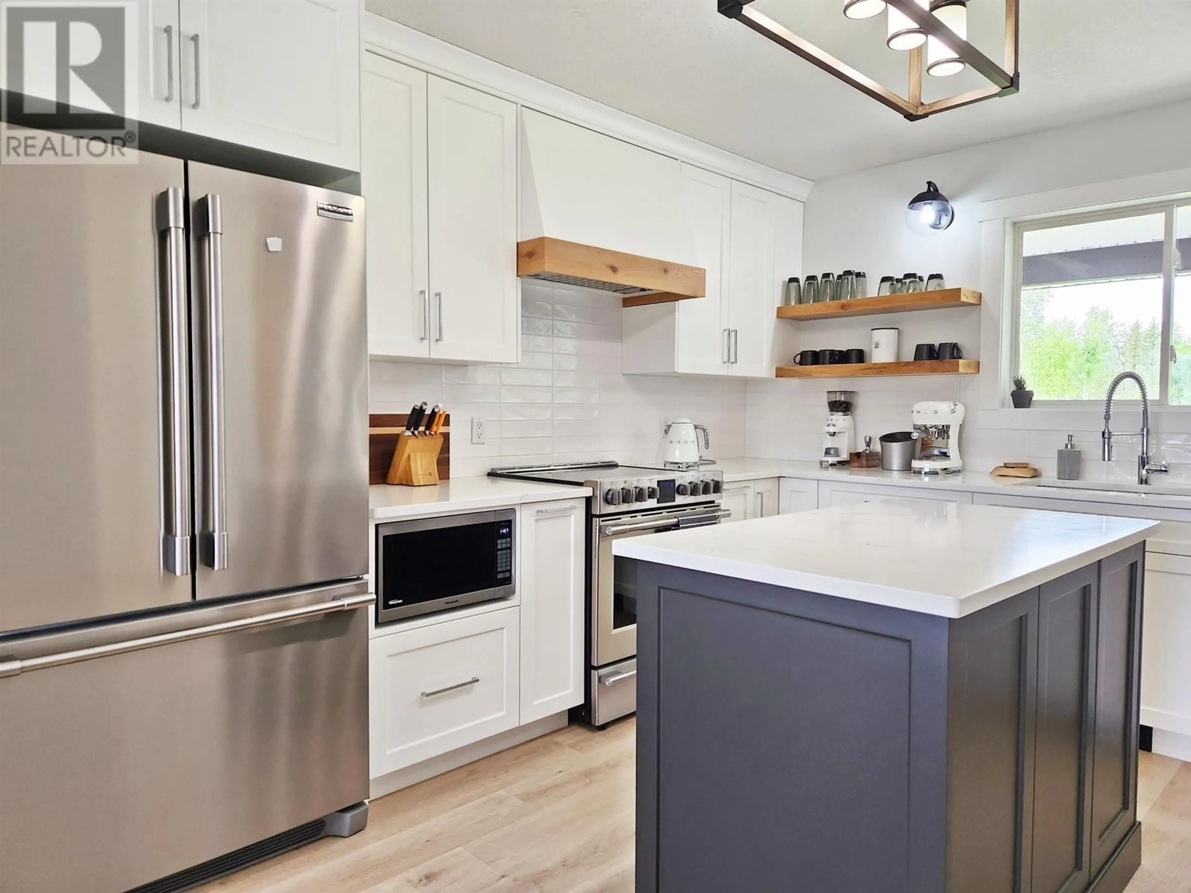 Open concept kitchen, wood/laminate floor for 2312 WEST FRASER ROAD, Quesnel British Columbia V2J6K1