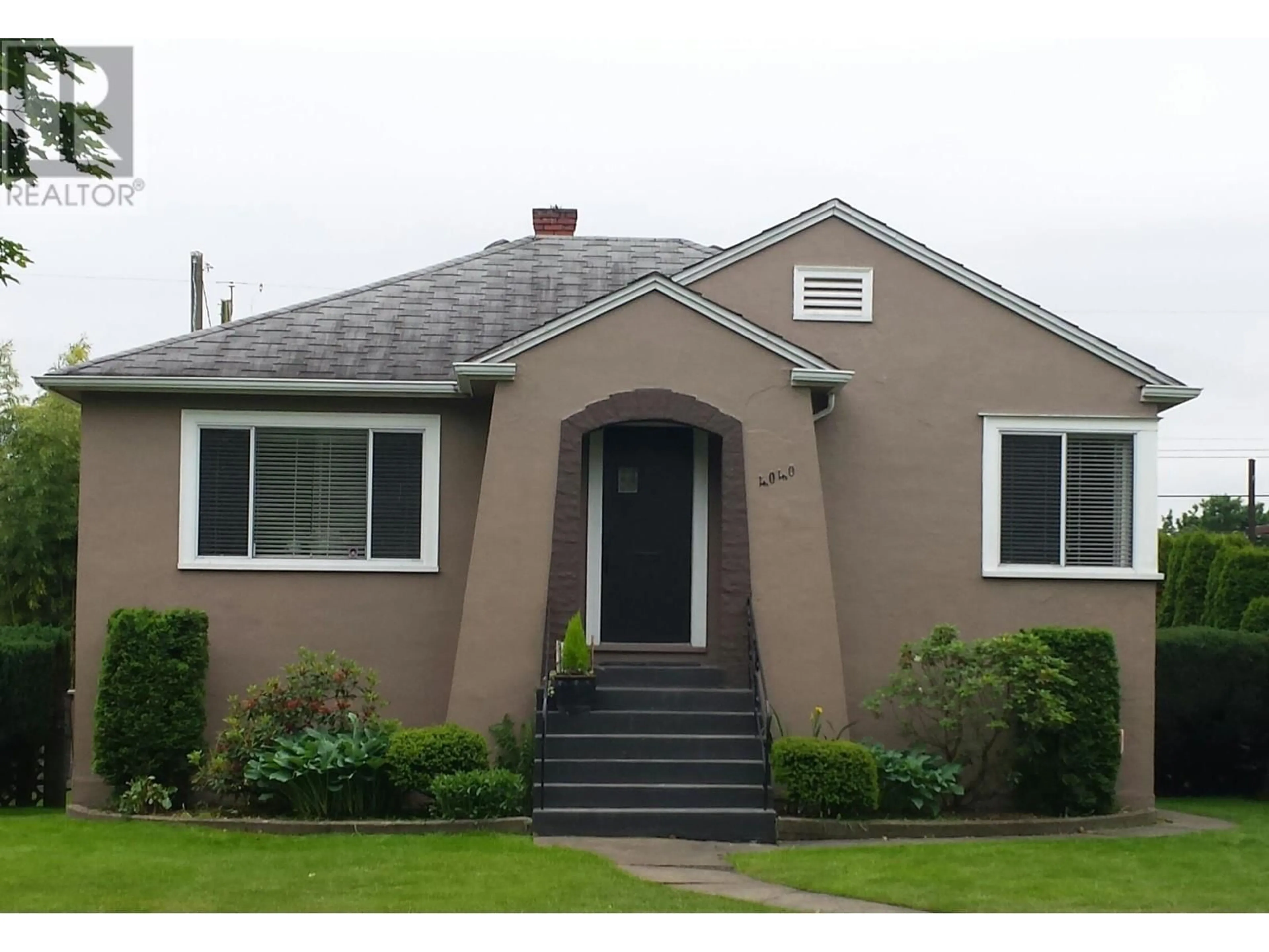 Home with vinyl exterior material, street for 4040 TRIUMPH STREET, Burnaby British Columbia V5C1Z2