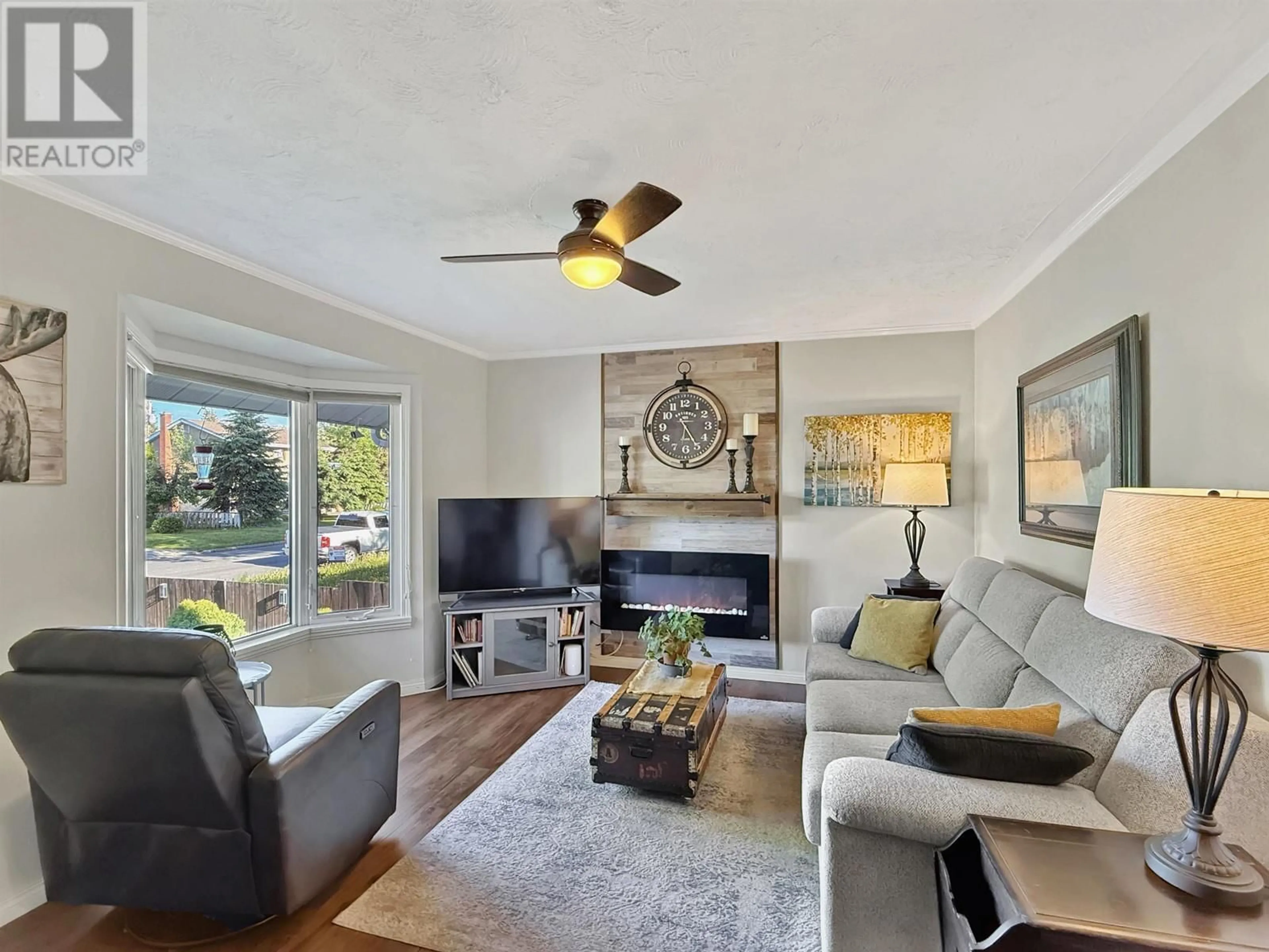 Living room with furniture, wood/laminate floor for 1745 NORWOOD STREET, Prince George British Columbia V2L1X7