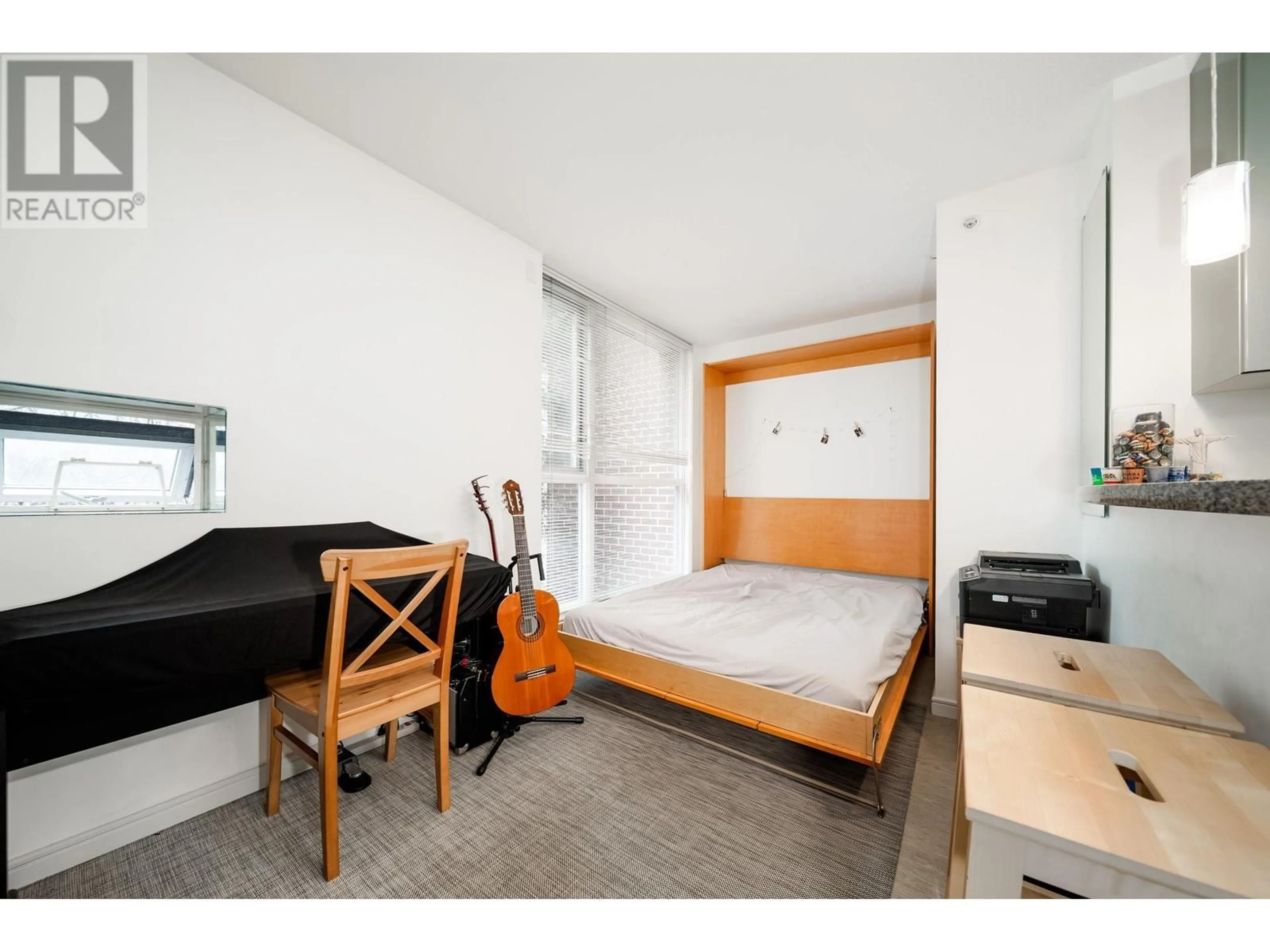 Bedroom with bed, wood/laminate floor for 305 - 1068 HORNBY STREET, Vancouver British Columbia V6Z2Y7