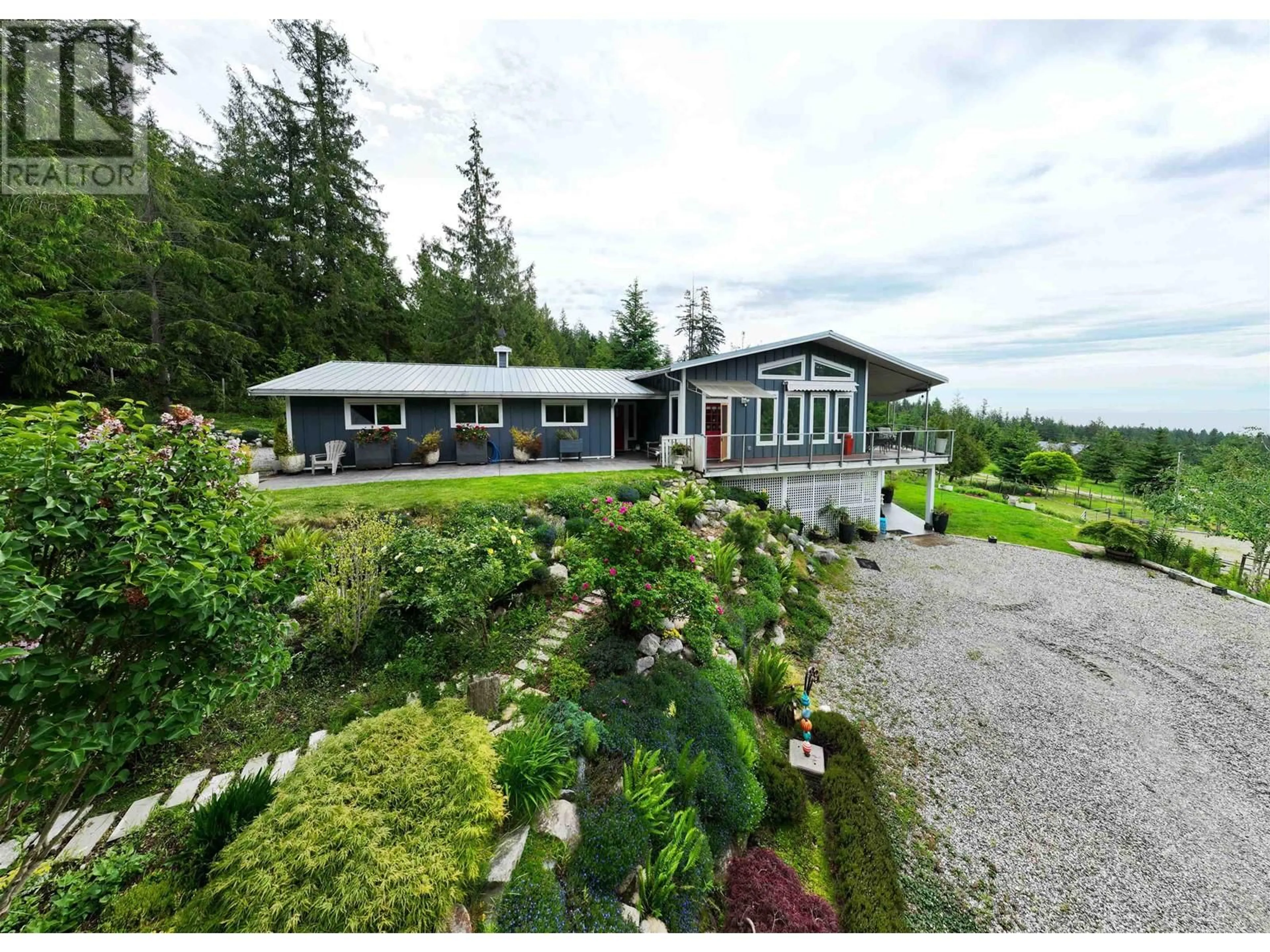 A pic from outside/outdoor area/front of a property/back of a property/a pic from drone, mountain view for 1088 BYNG ROAD, Roberts Creek British Columbia V0N2W5