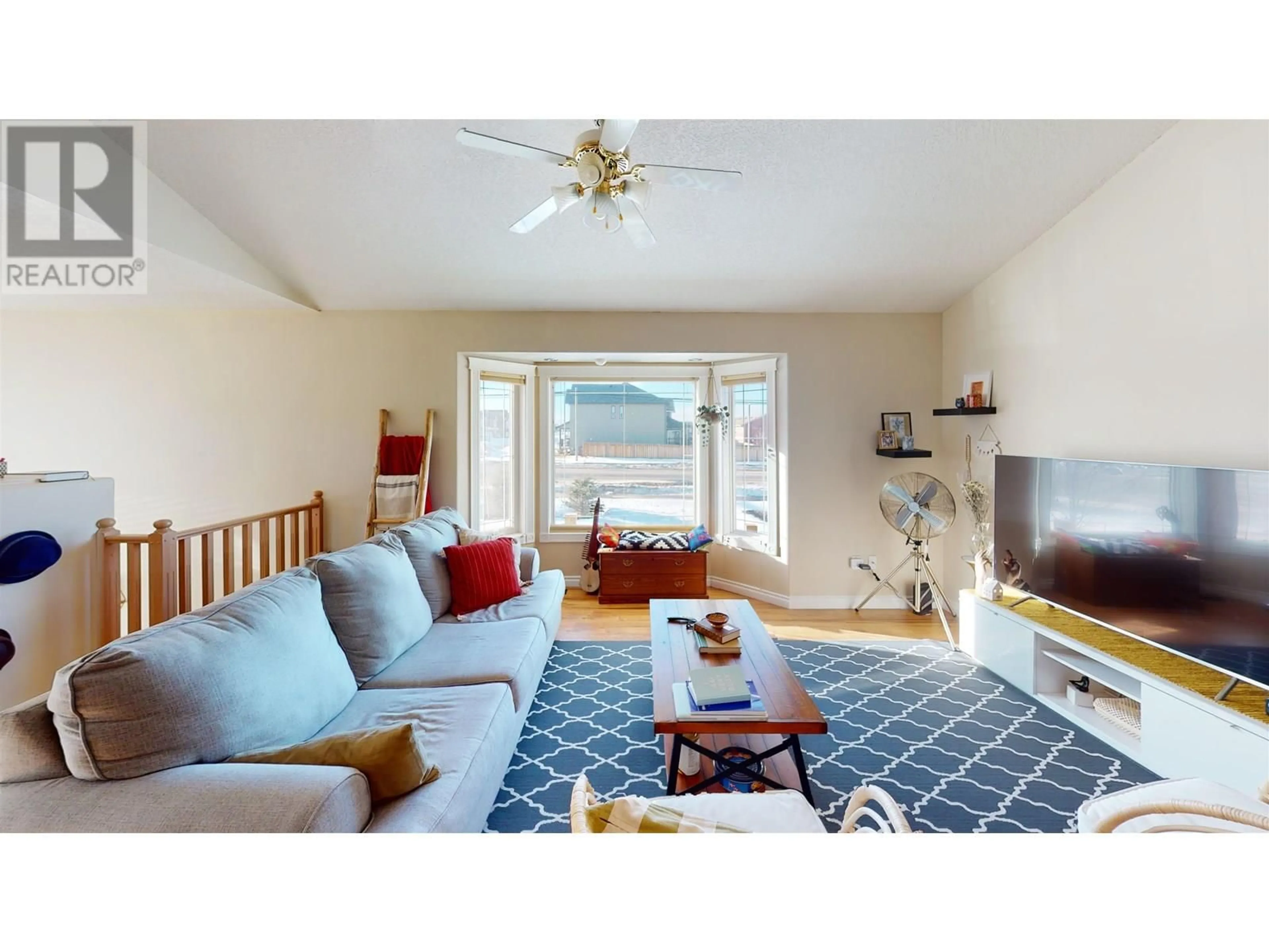 Living room with furniture, unknown for 9922 117 AVENUE, Fort St. John British Columbia V1J0E9