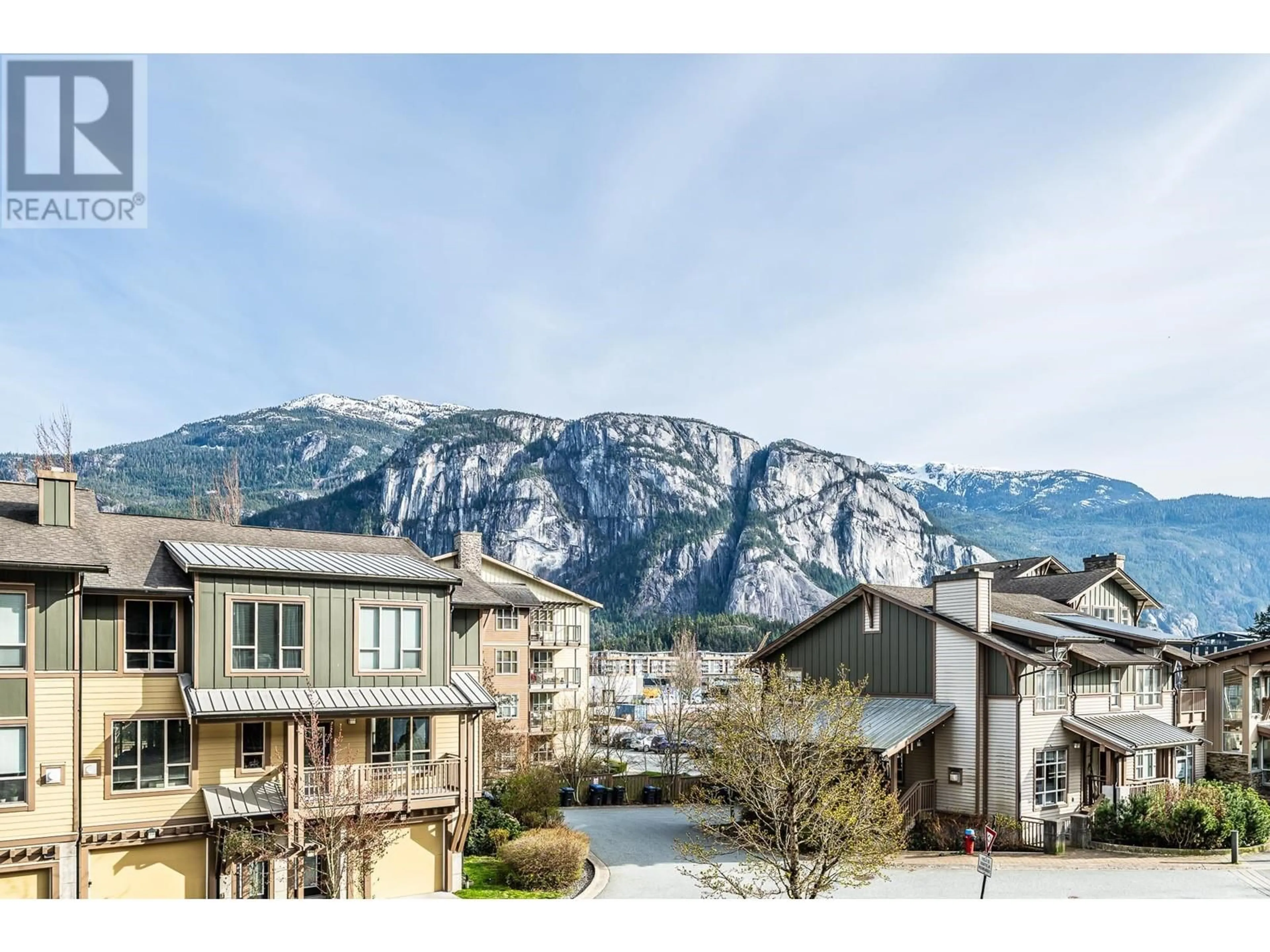 A pic from outside/outdoor area/front of a property/back of a property/a pic from drone, mountain view for 320 - 1211 VILLAGE GREEN WAY, Squamish British Columbia V8B0R7