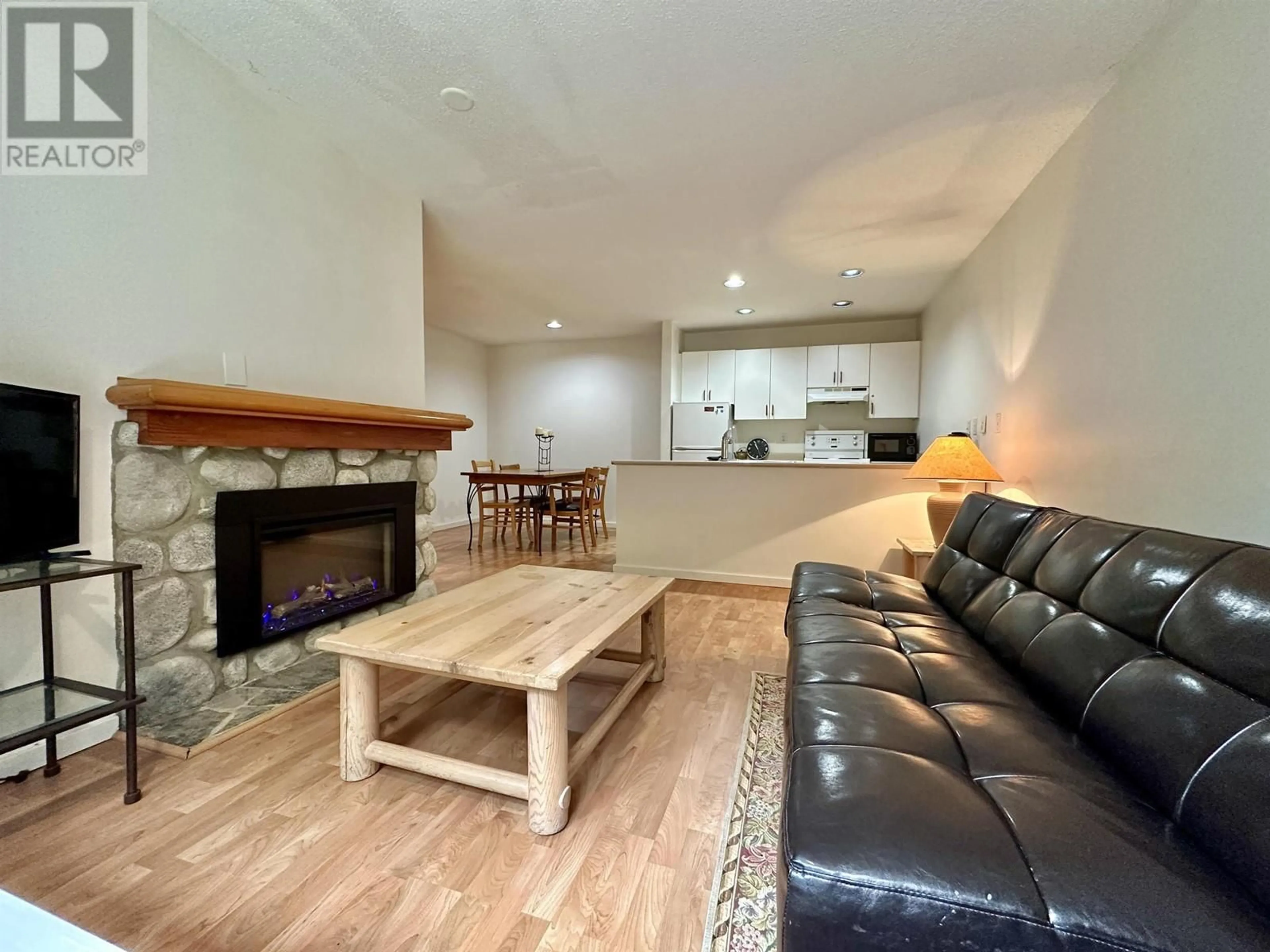 Living room with furniture, wood/laminate floor for 21 - 2050 LAKE PLACID ROAD, Whistler British Columbia V0N1B2