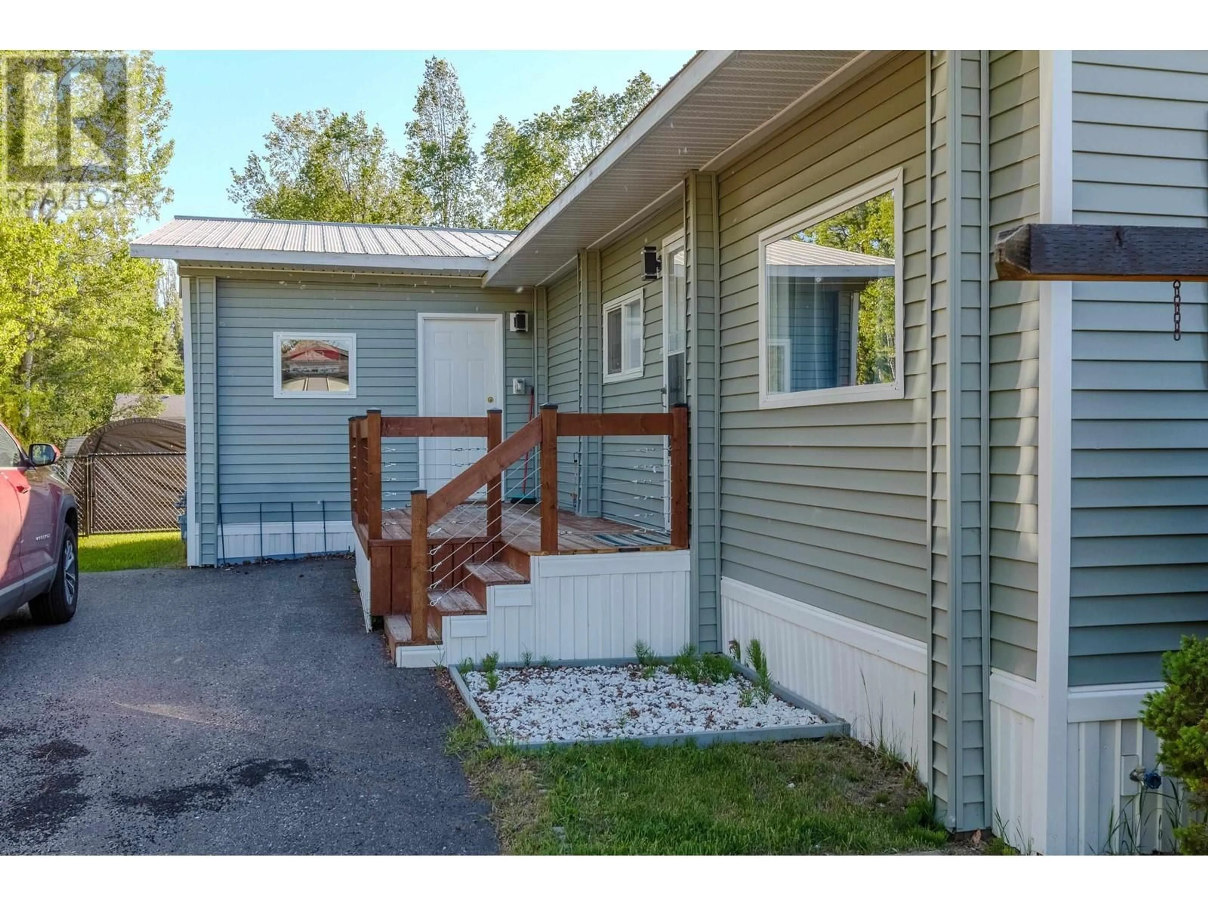 Home with vinyl exterior material, street for 7011 TAFT DRIVE, Prince George British Columbia V2K2R3