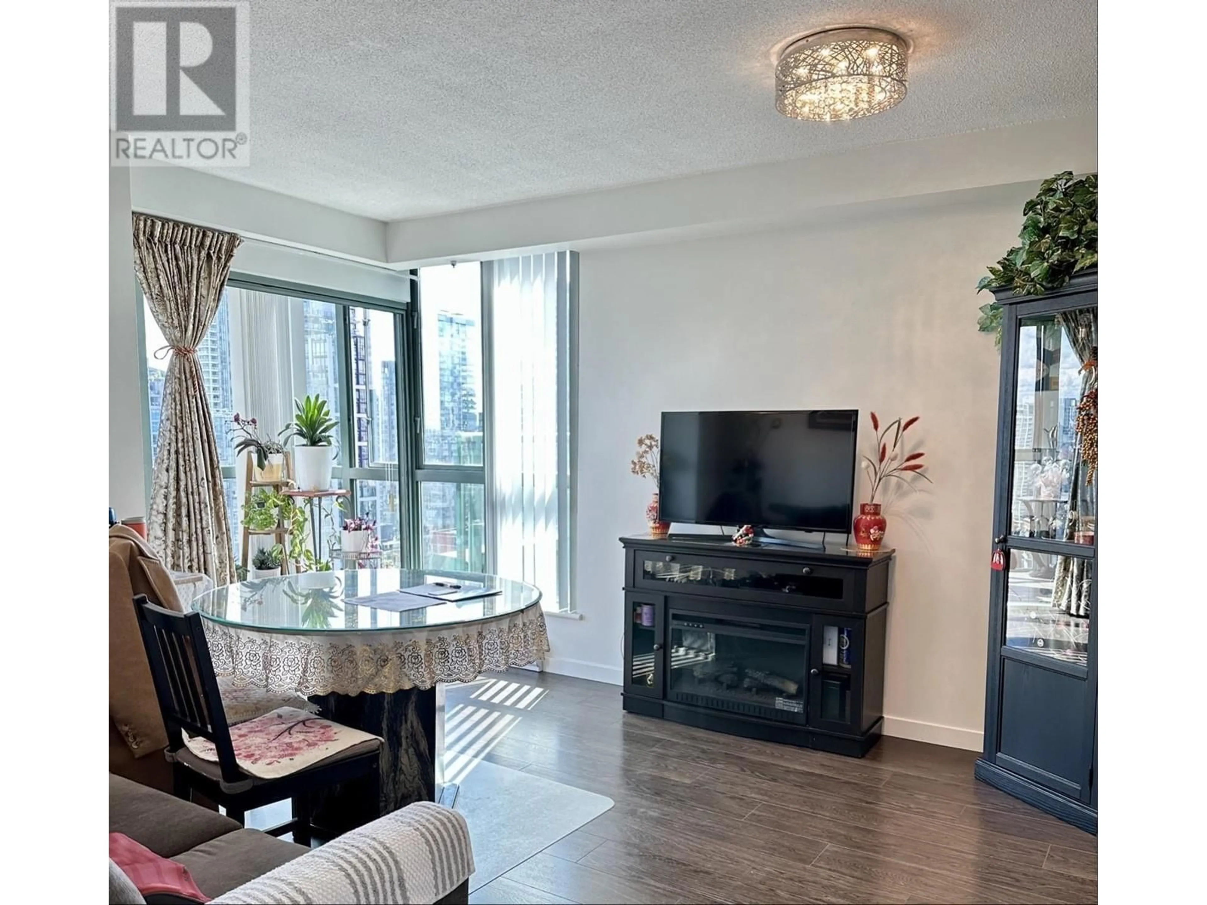 Living room with furniture, wood/laminate floor for 2303 - 1188 HOWE STREET, Vancouver British Columbia V6Z2S8