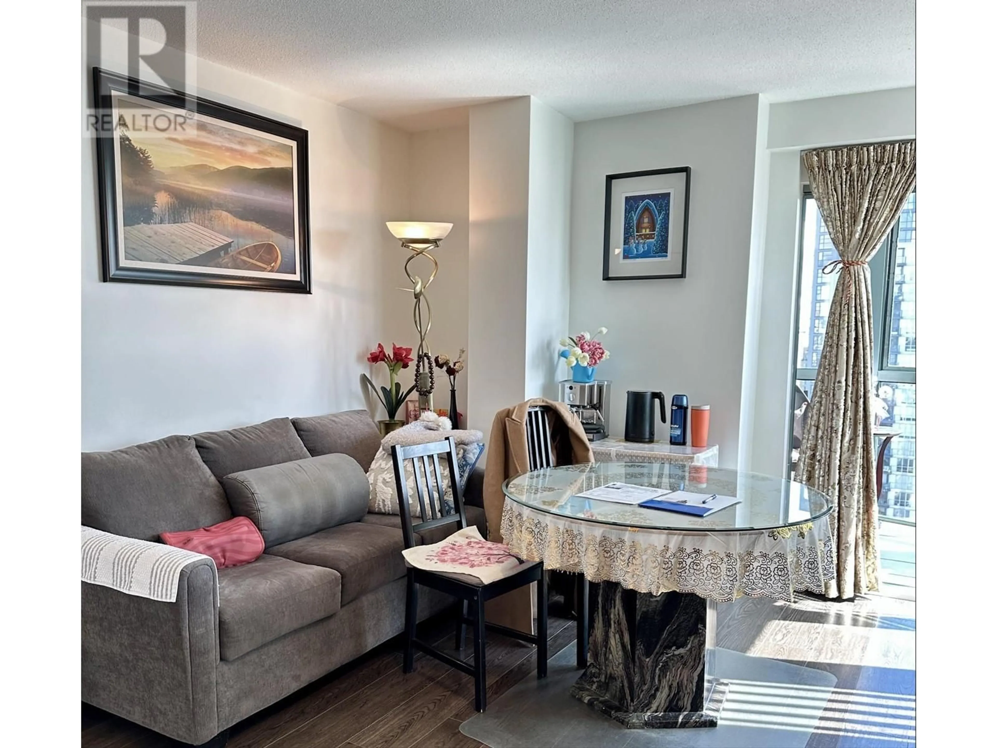 Living room with furniture, wood/laminate floor for 2303 - 1188 HOWE STREET, Vancouver British Columbia V6Z2S8