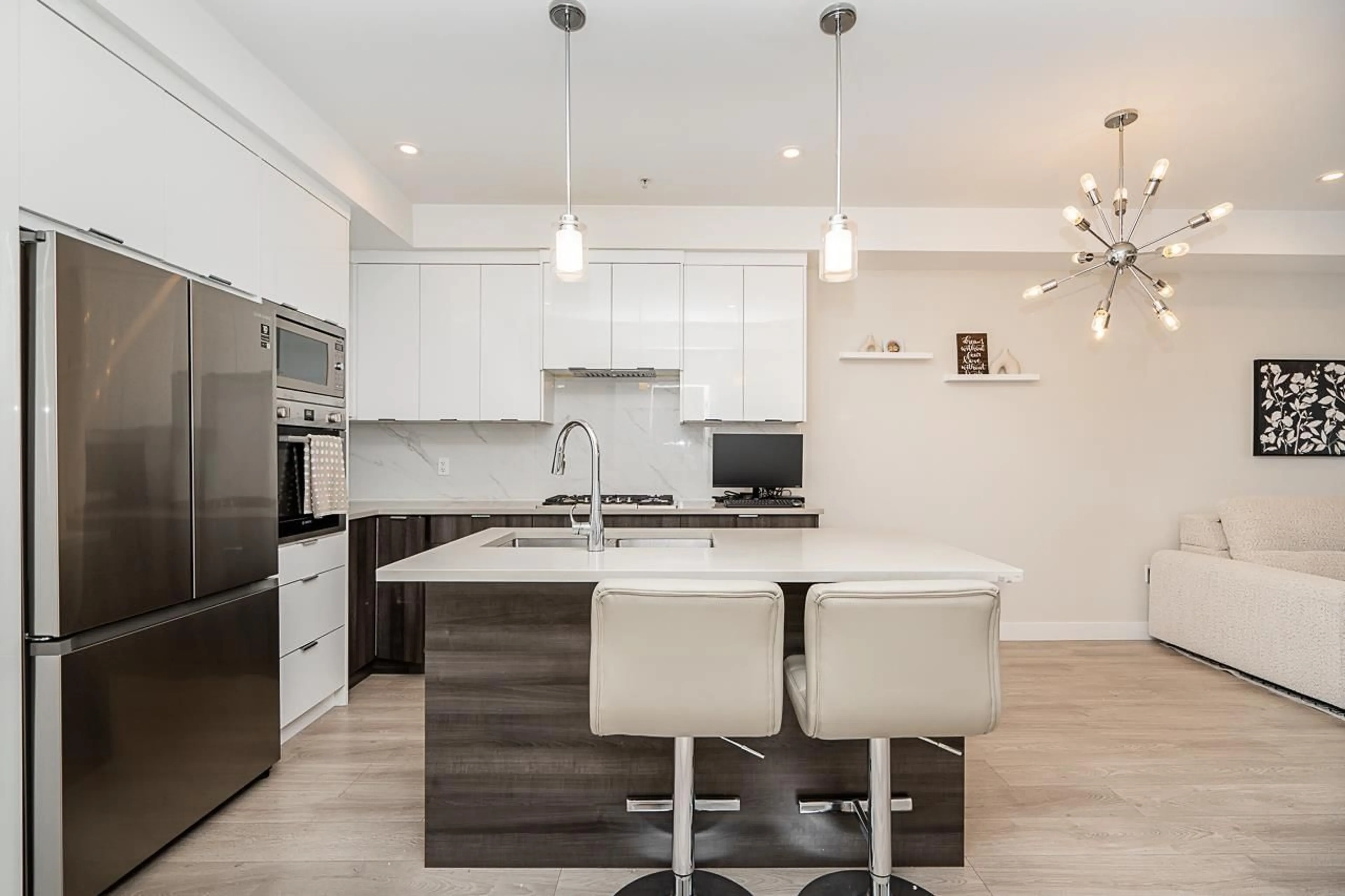 Open concept kitchen, wood/laminate floor for A402 - 14468 72, Surrey British Columbia V3S2E7