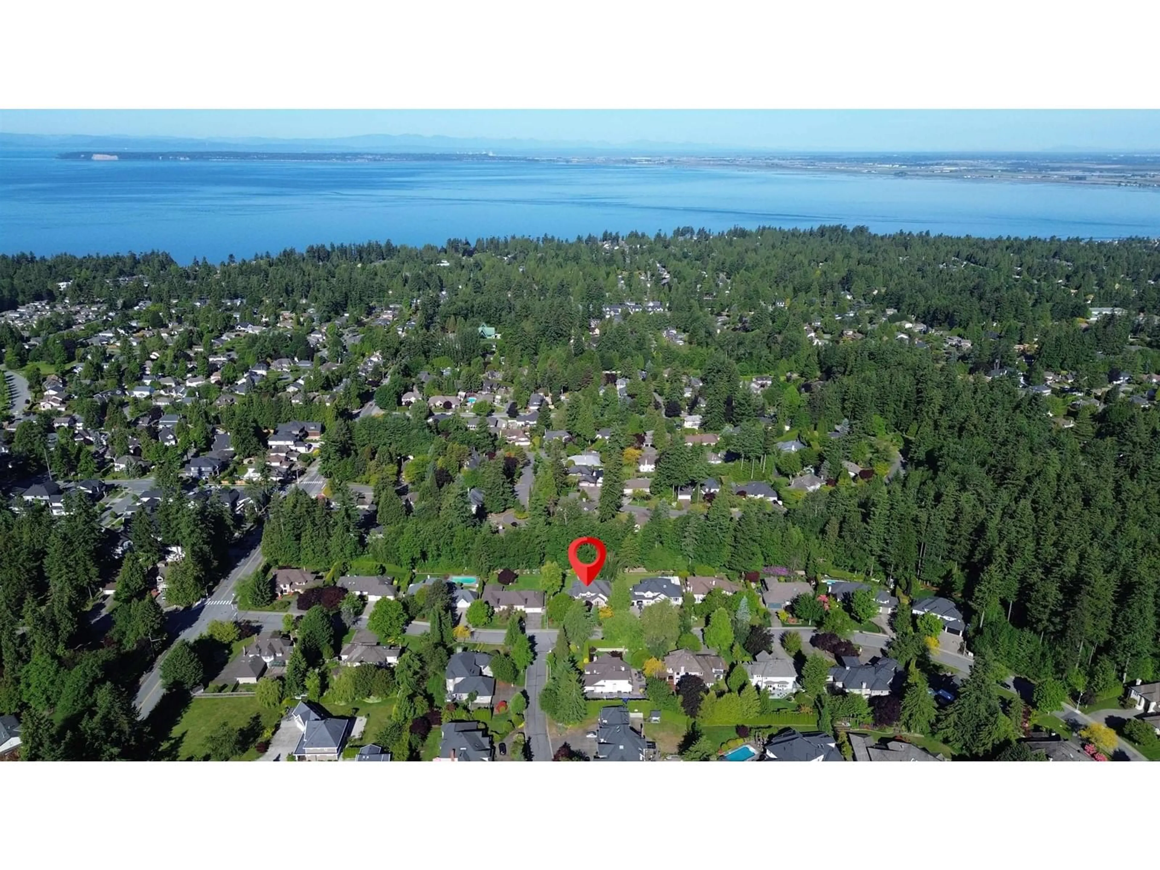 A pic from outside/outdoor area/front of a property/back of a property/a pic from drone, water/lake/river/ocean view for 2065 132A, Surrey British Columbia V4A9K2