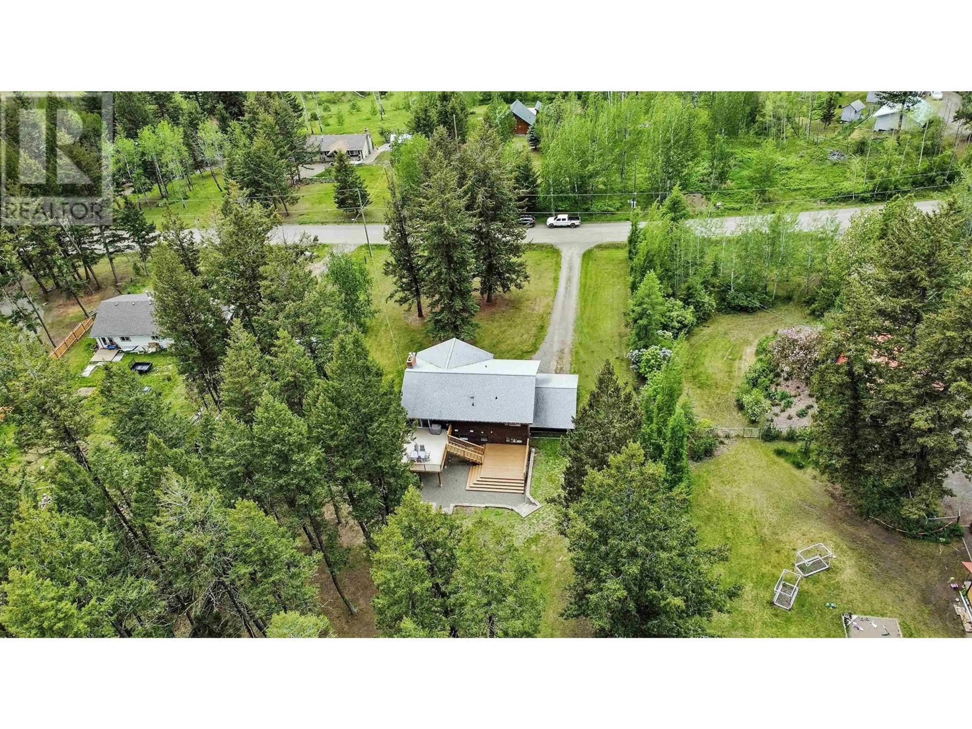 A pic from outside/outdoor area/front of a property/back of a property/a pic from drone, forest/trees view for 5023 BLOCK DRIVE, 108 Mile Ranch British Columbia V0K2Z0