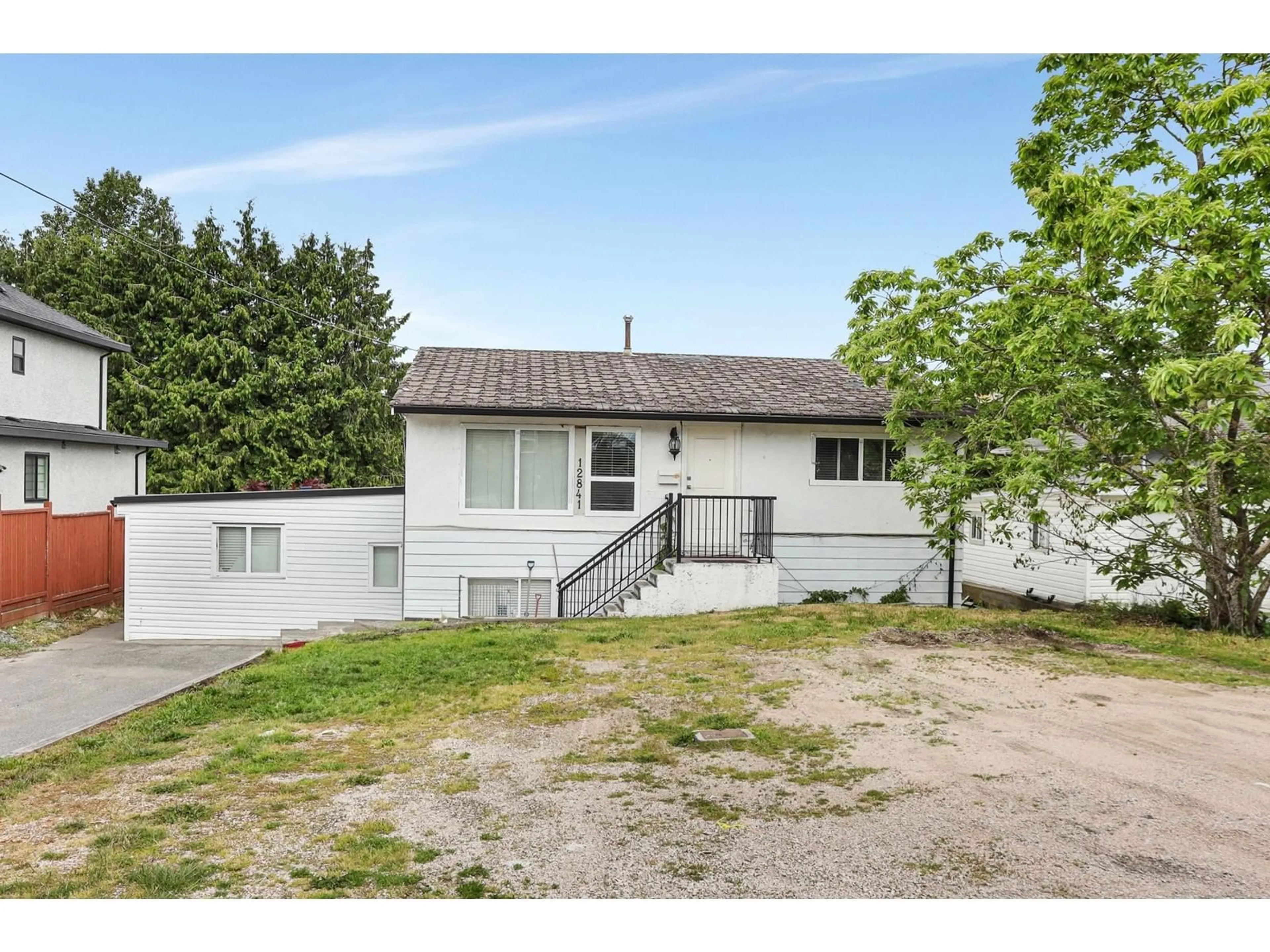 A pic from outside/outdoor area/front of a property/back of a property/a pic from drone, street for 12841 98, Surrey British Columbia V3T1B1