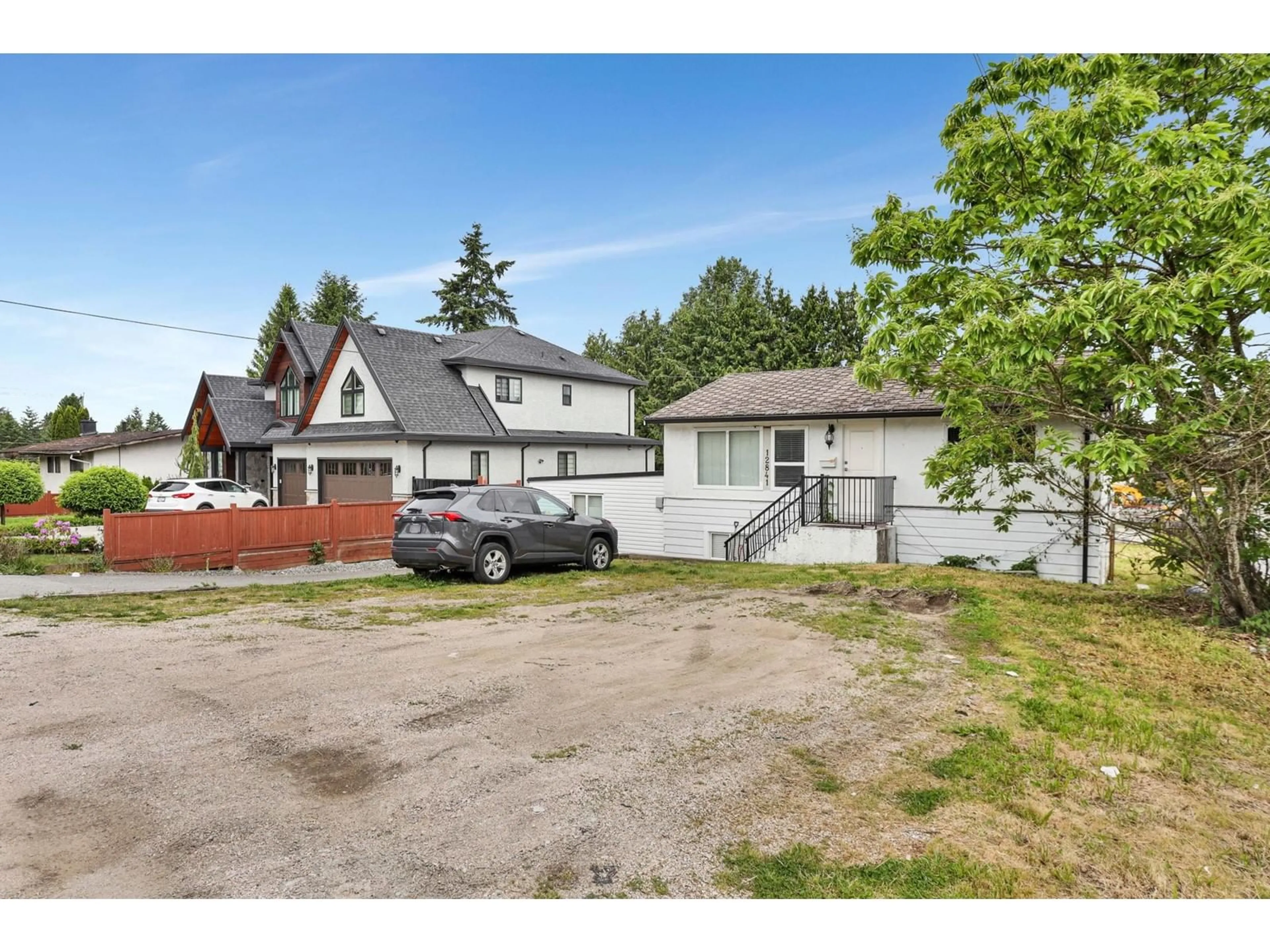 A pic from outside/outdoor area/front of a property/back of a property/a pic from drone, street for 12841 98, Surrey British Columbia V3T1B1