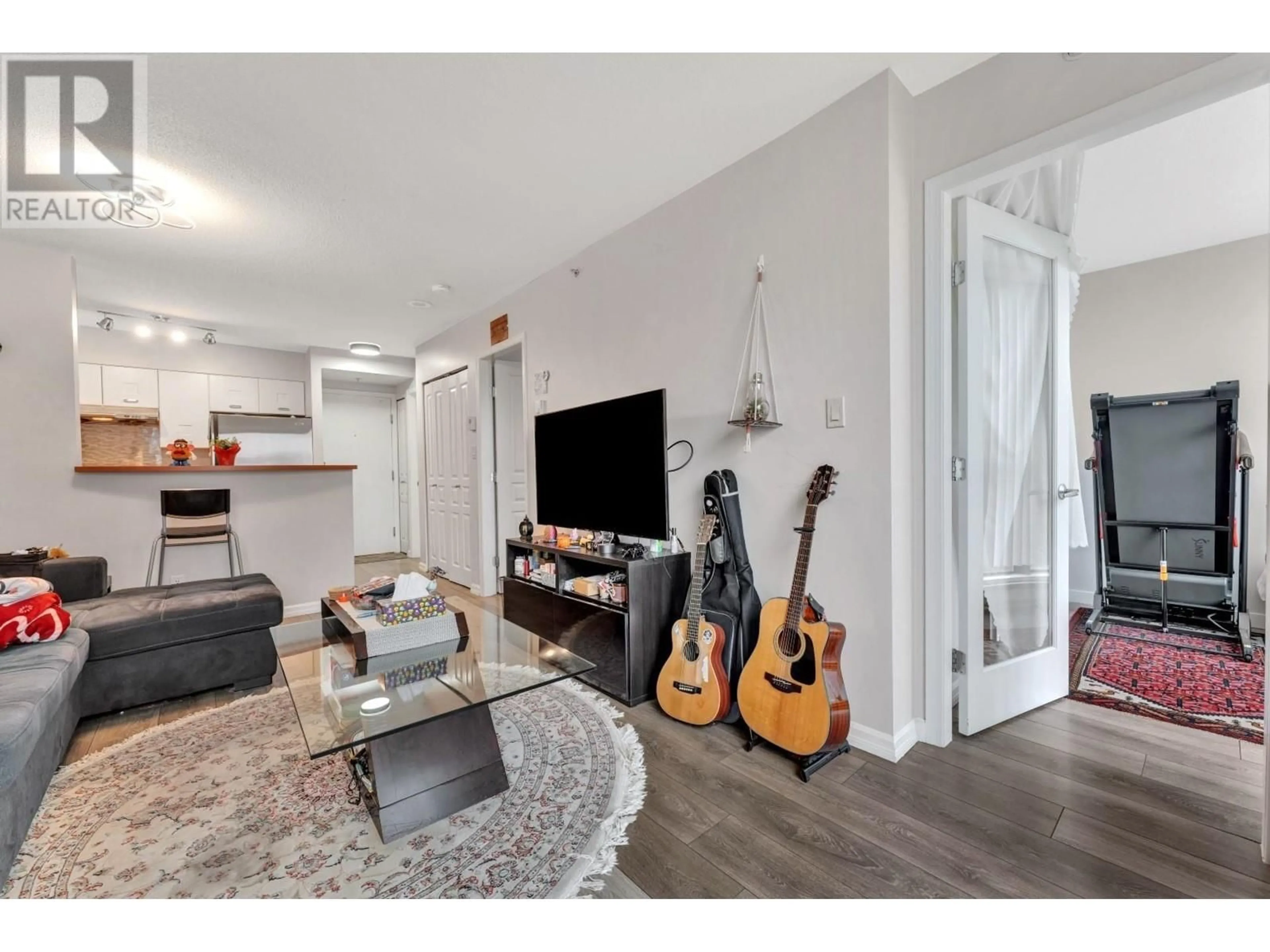 Living room with furniture, wood/laminate floor for 502 - 3438 VANNESS AVENUE, Vancouver British Columbia V5R6E7