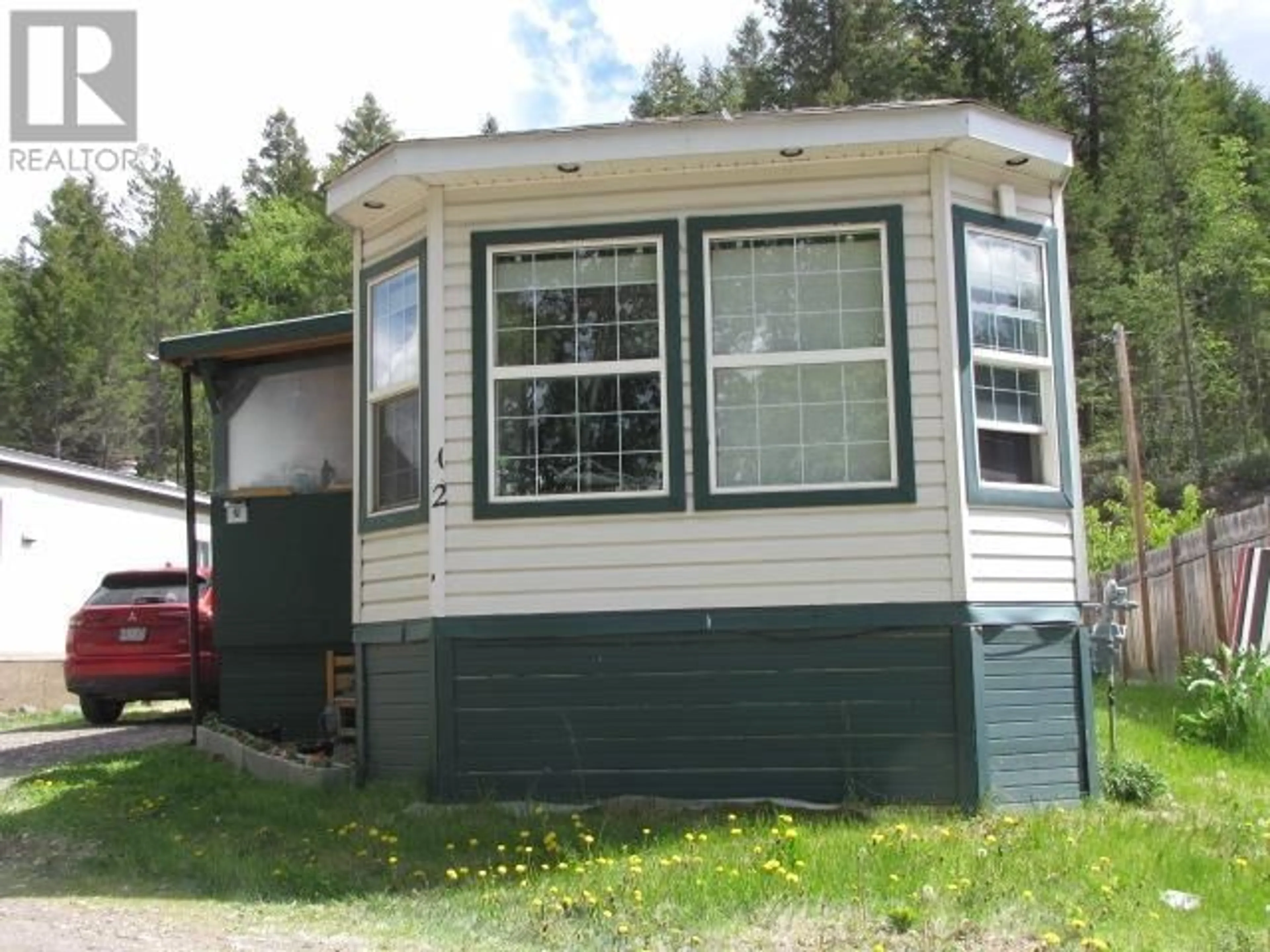Home with vinyl exterior material, street for 12 - 3028 PIGEON ROAD, 150 Mile House British Columbia V0K2G0
