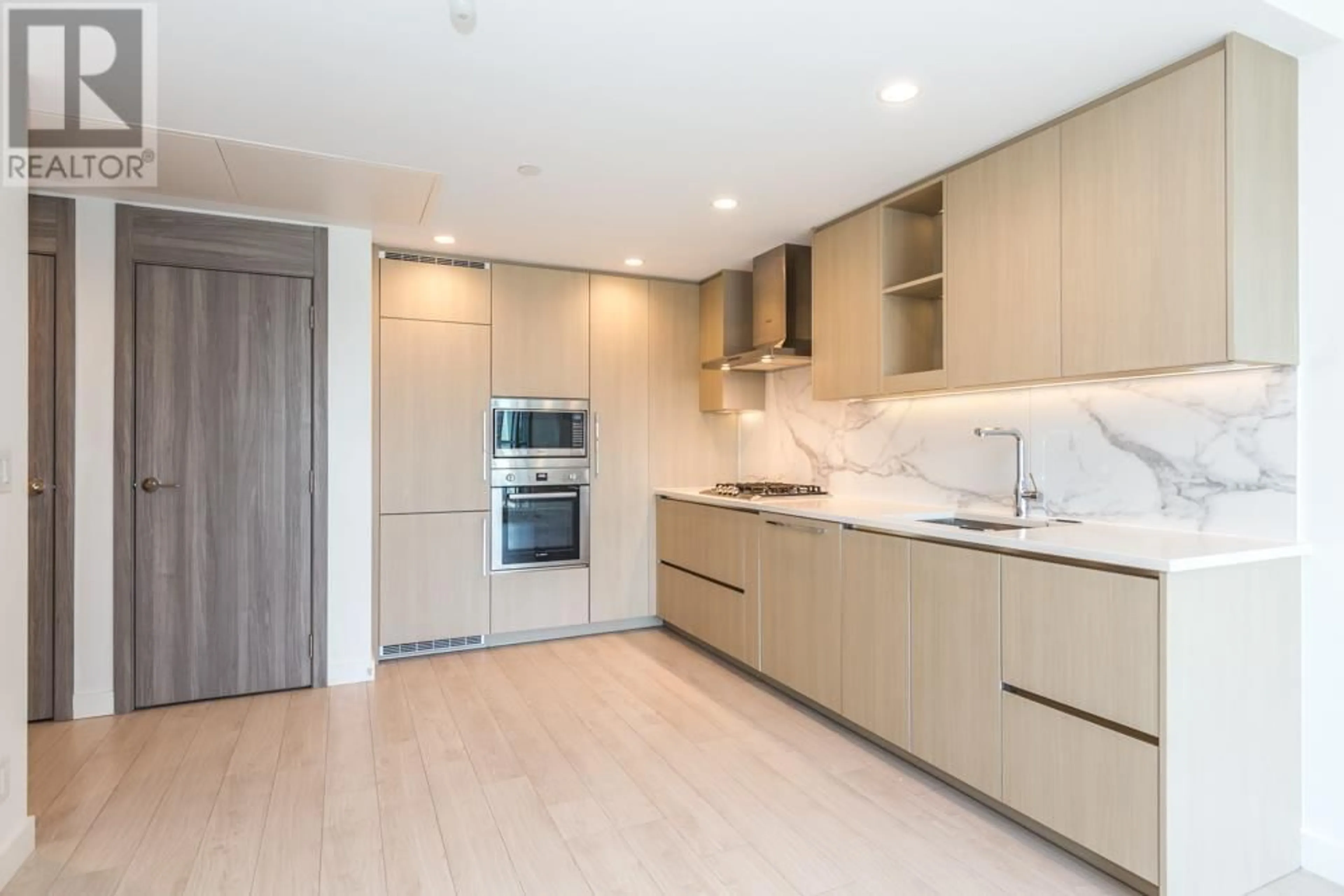 Open concept kitchen, wood/laminate floor for 501 - 4880 LOUGHEED HIGHWAY, Burnaby British Columbia V5C0N1