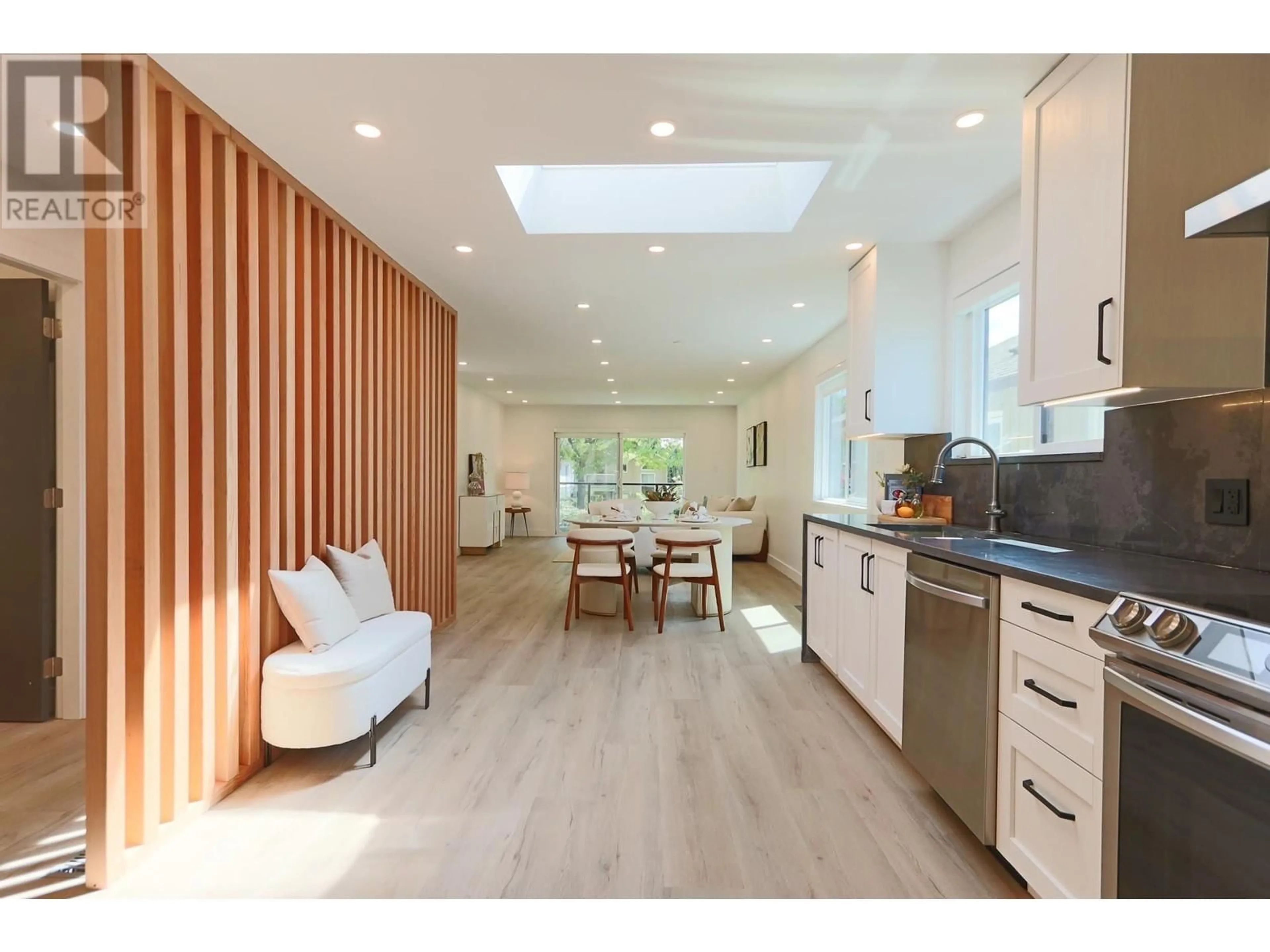 Open concept kitchen, wood/laminate floor for 1685 BOWSER AVENUE, North Vancouver British Columbia V7P2Y6