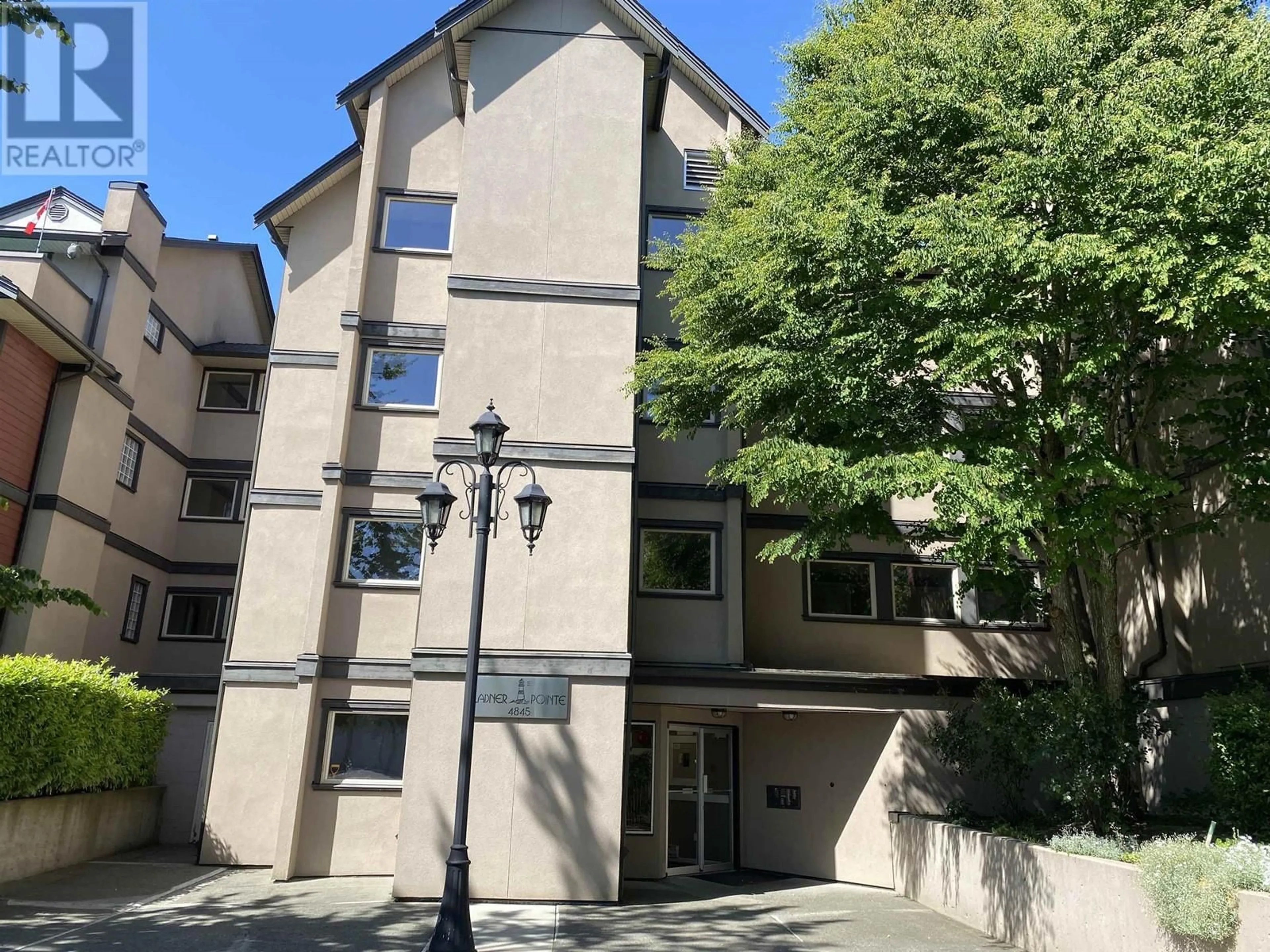 A pic from outside/outdoor area/front of a property/back of a property/a pic from drone, street for D304 - 4845 53 STREET, Ladner British Columbia V4K2Z3