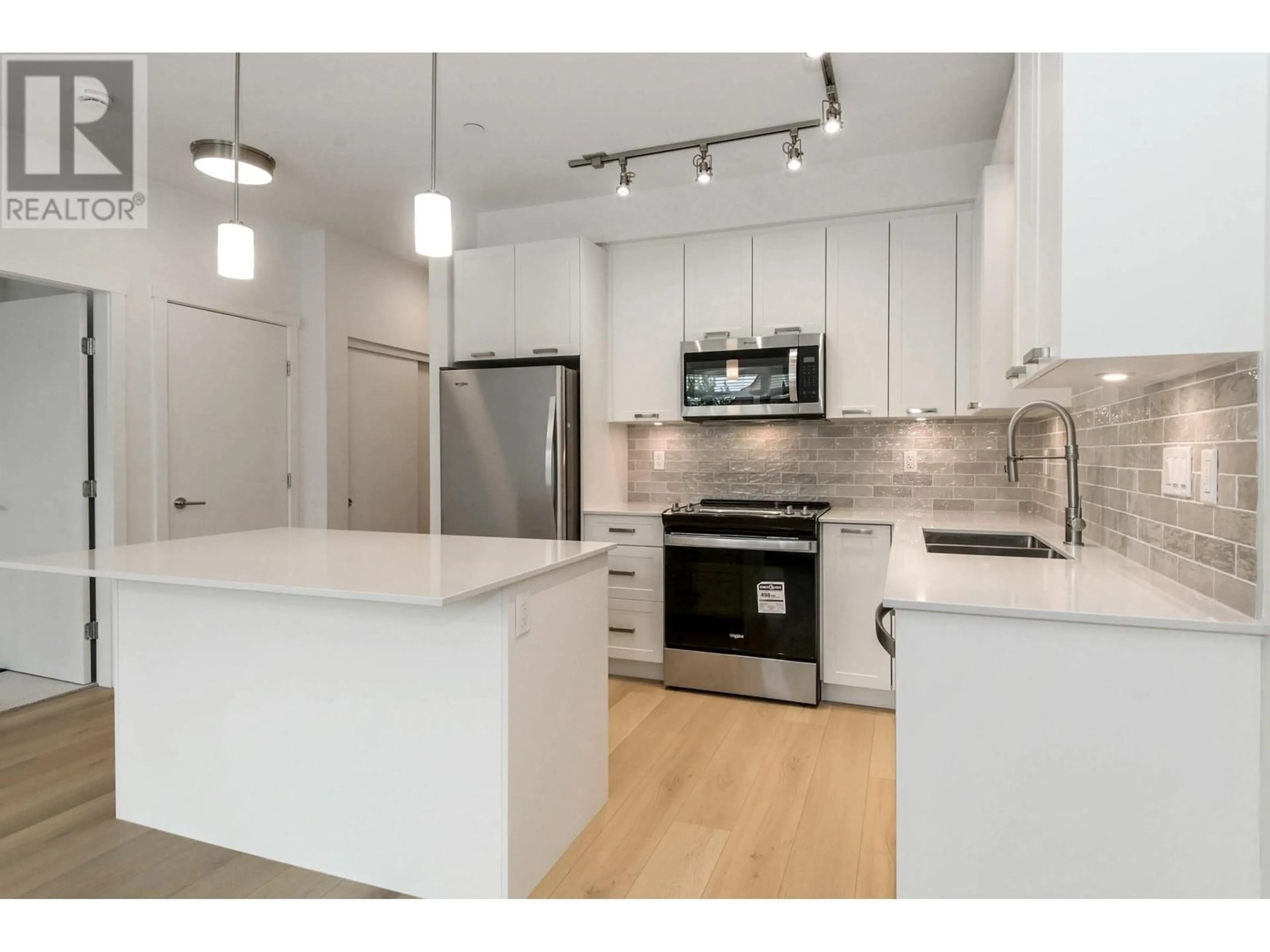 Open concept kitchen, unknown for 113 - 22562 121 AVENUE, Maple Ridge British Columbia V2X3Y8