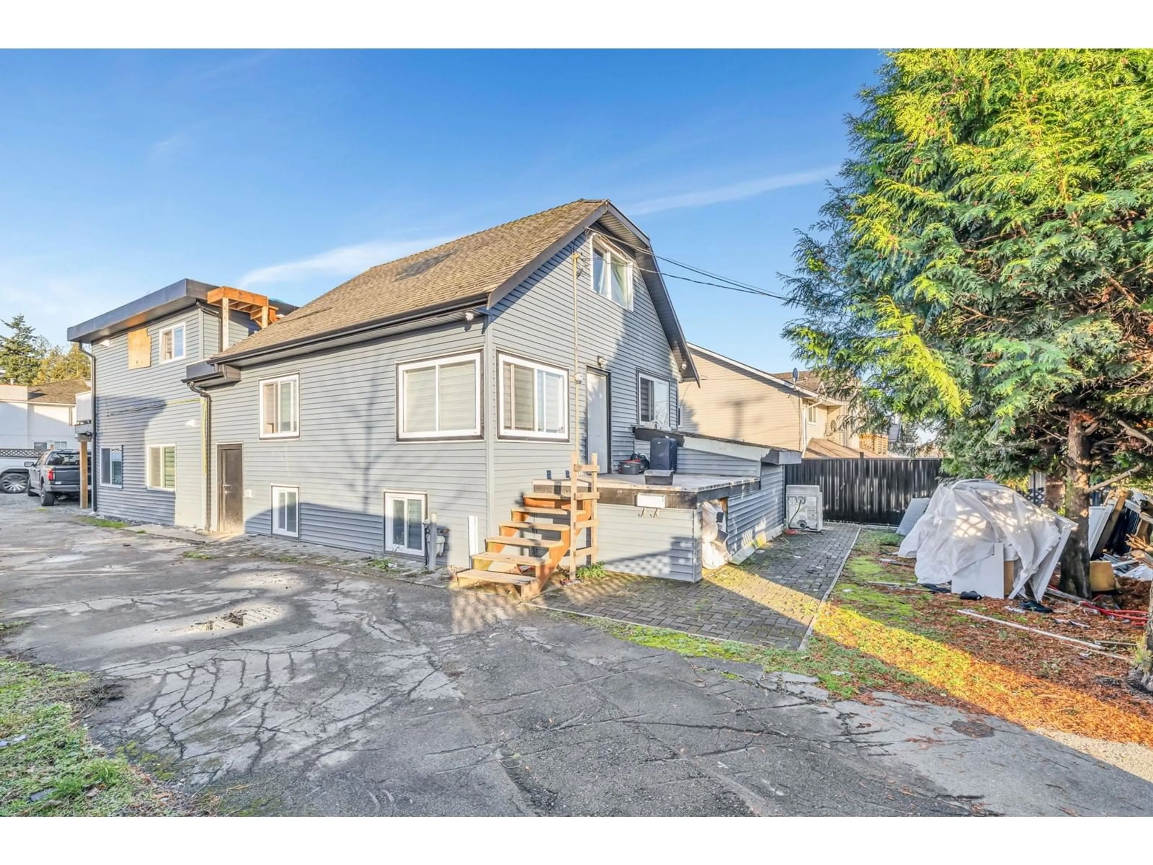 A pic from outside/outdoor area/front of a property/back of a property/a pic from drone, street for 13065 96, Surrey British Columbia V3V1Y2