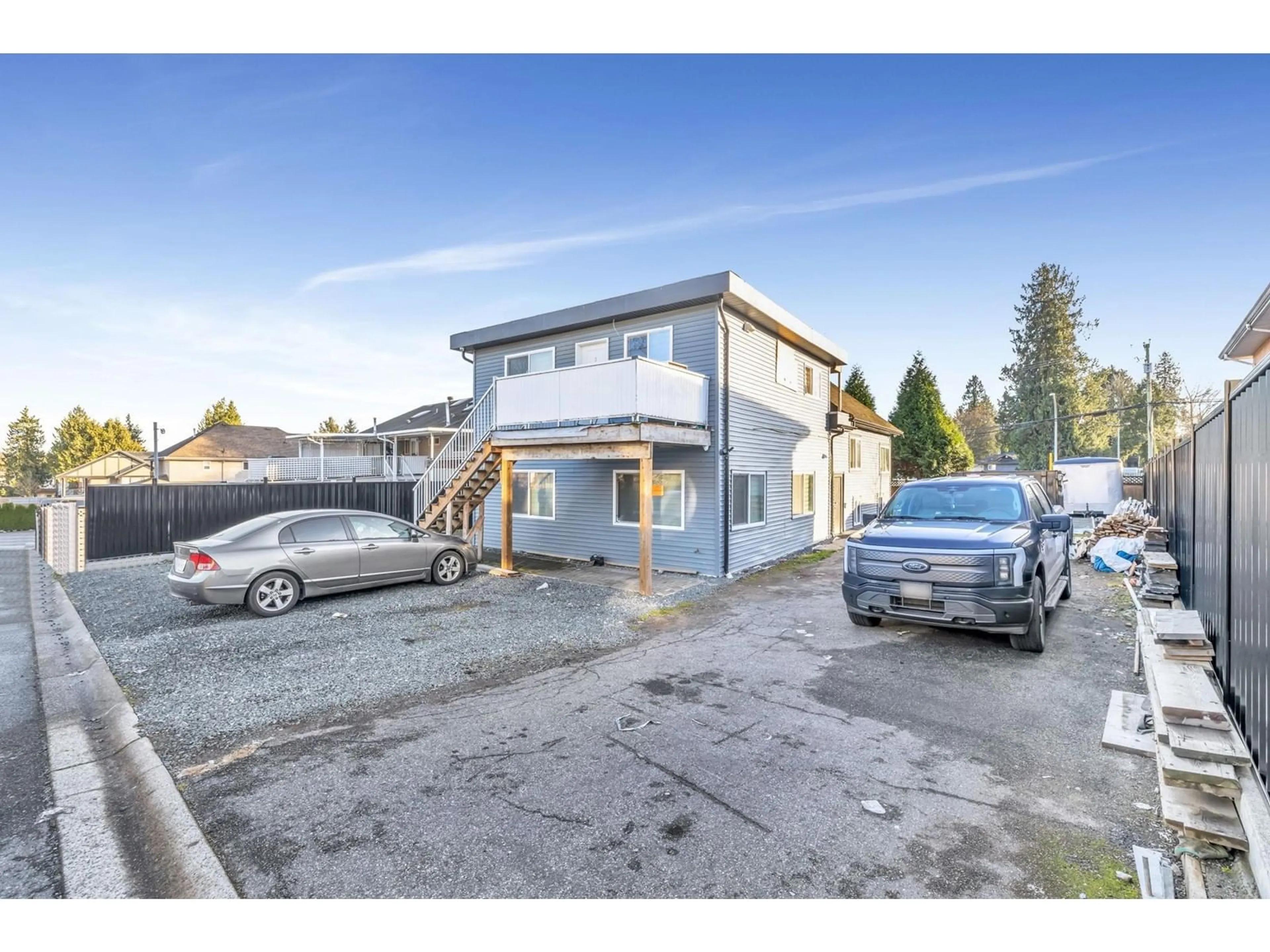 A pic from outside/outdoor area/front of a property/back of a property/a pic from drone, building for 13065 96, Surrey British Columbia V3V1Y2