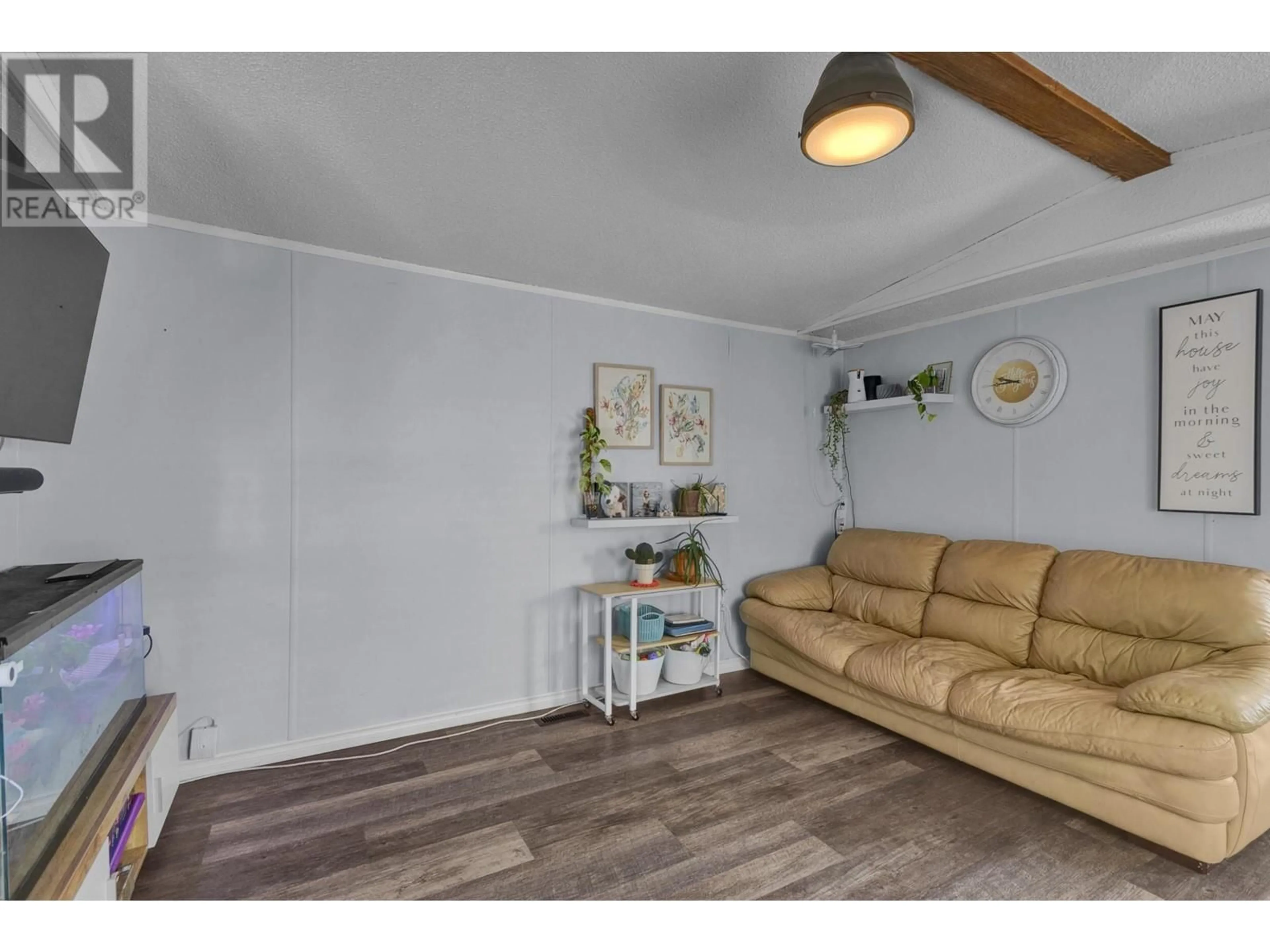 Living room with furniture, wood/laminate floor for 3037 THEE COURT, Prince George British Columbia V2K5B5